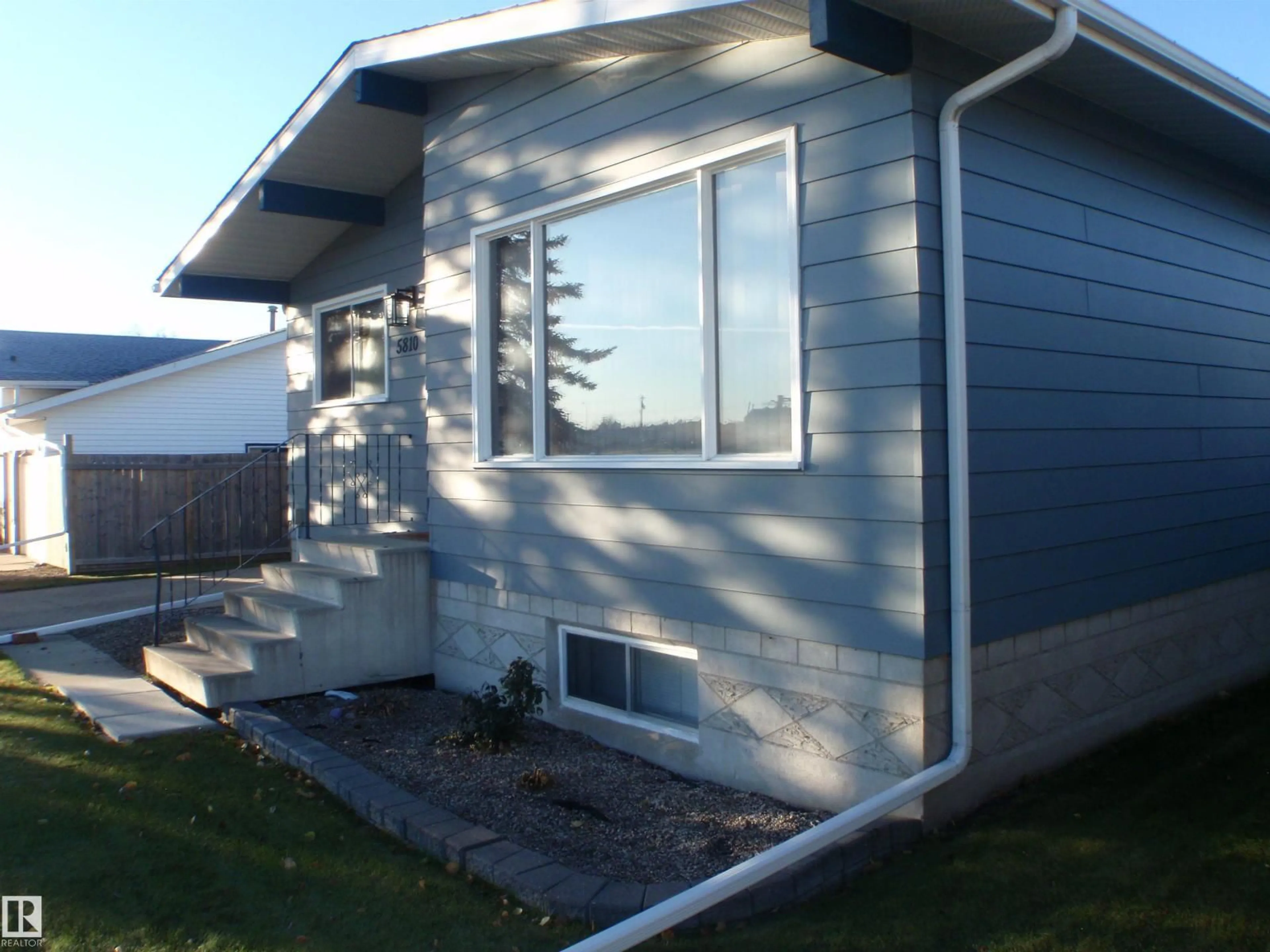 Home with vinyl exterior material, street for 5810 53 ST, Barrhead Alberta T7N1N1