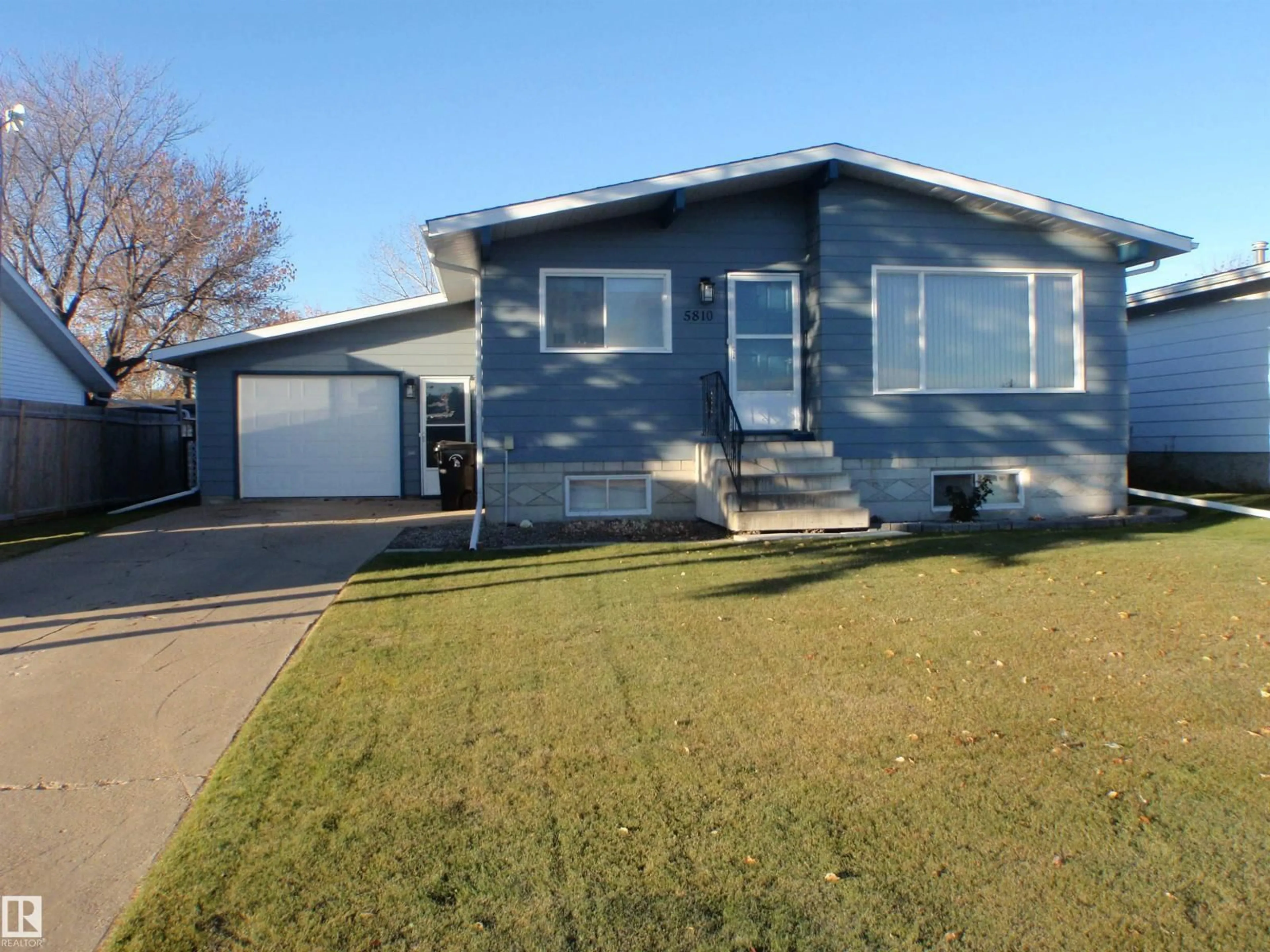 Home with vinyl exterior material, street for 5810 53 ST, Barrhead Alberta T7N1N1