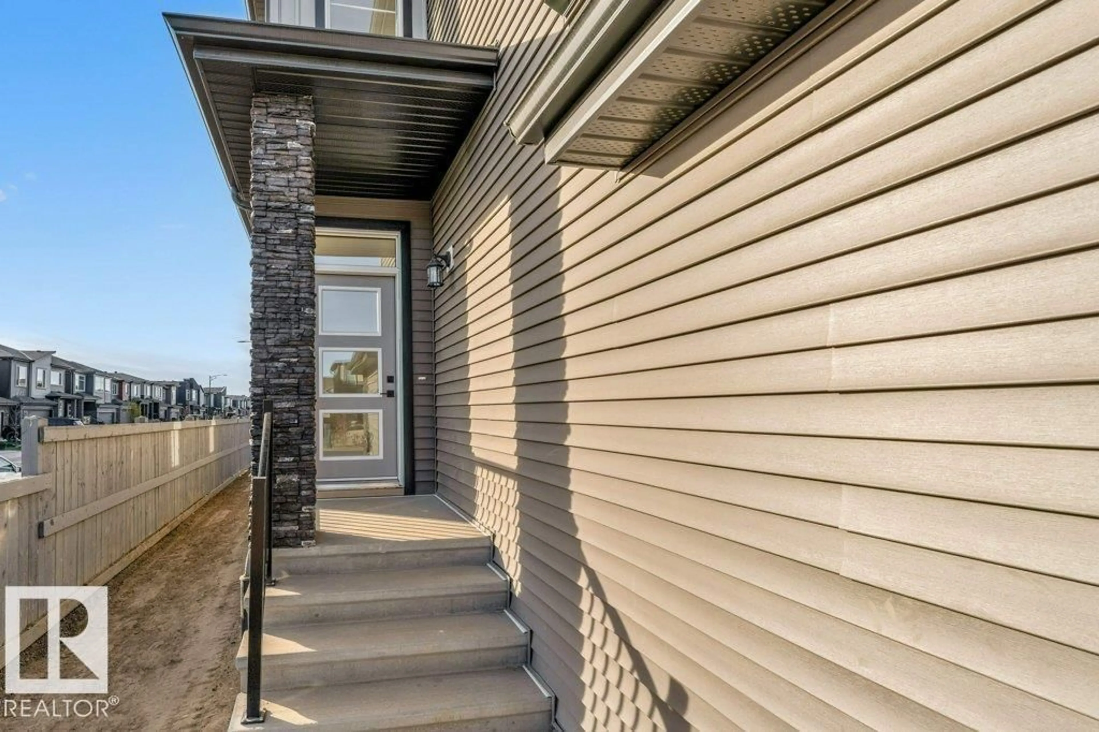 Home with vinyl exterior material, street for 5442 KOOTOOK RD, Edmonton Alberta T6W4Z7