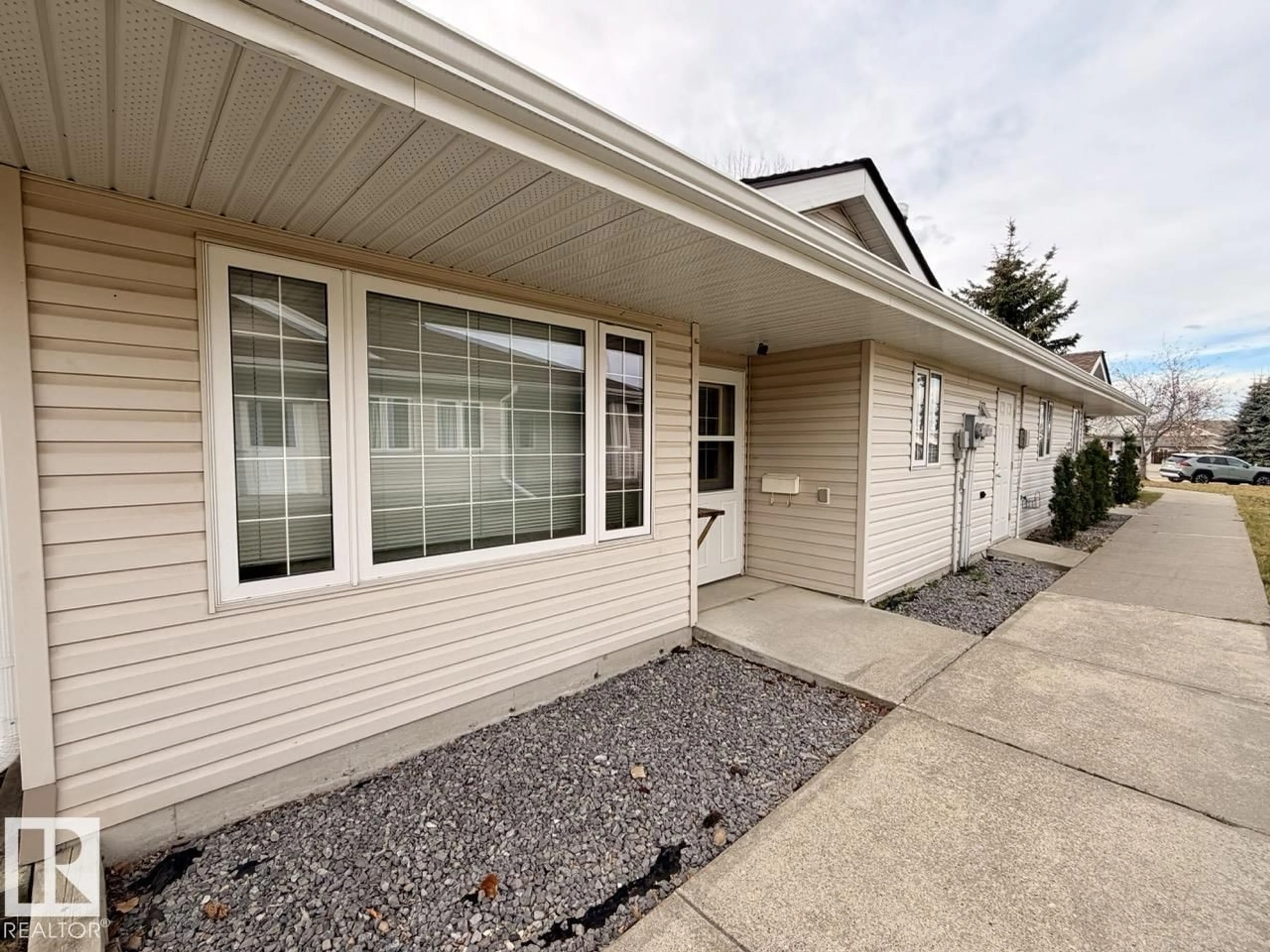 Home with vinyl exterior material, street for #4 - 4548 MADSEN AV, Drayton Valley Alberta T7A1N8