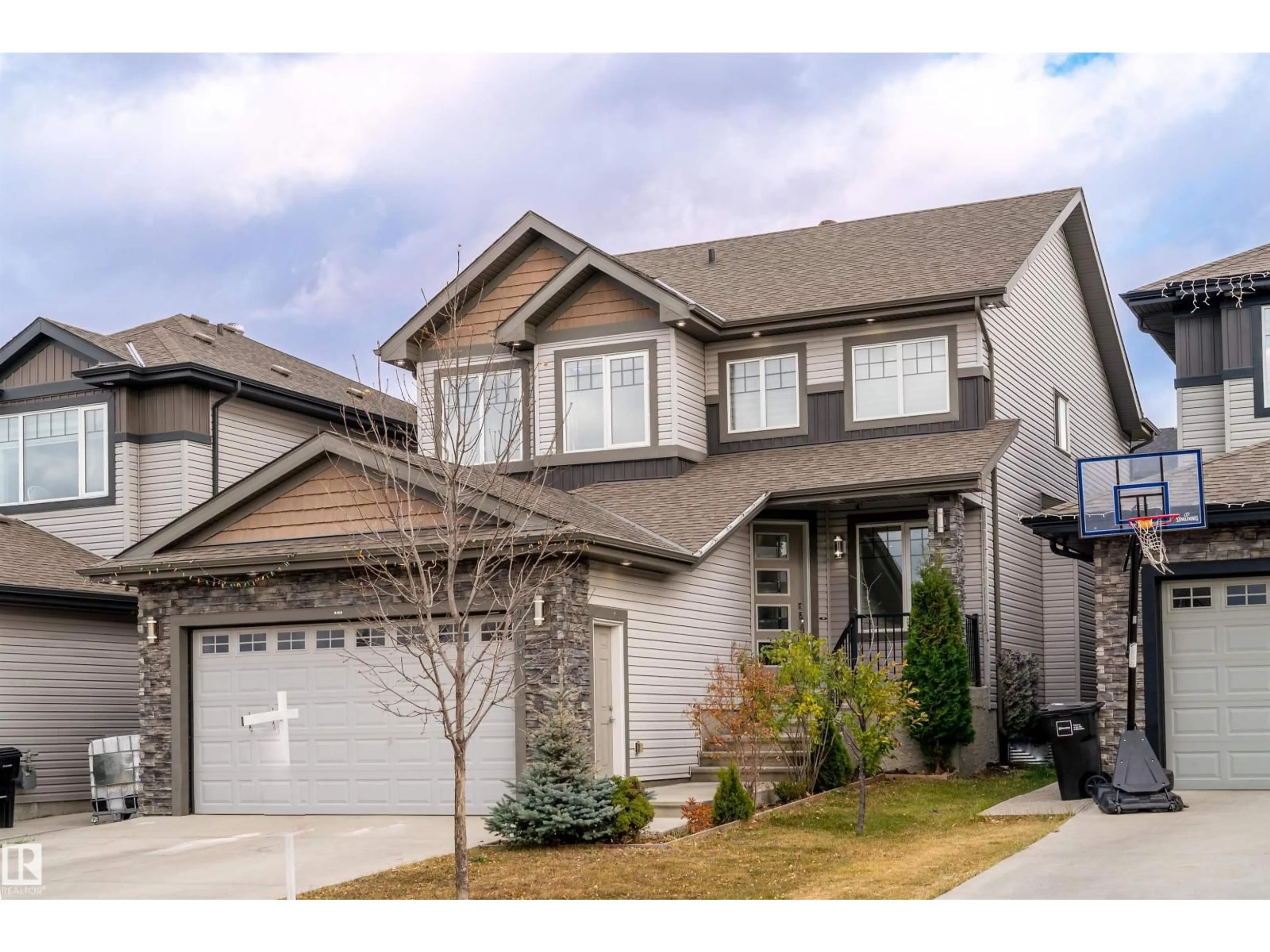 Home with vinyl exterior material, street for 2109 53 ST, Edmonton Alberta T6X1X3