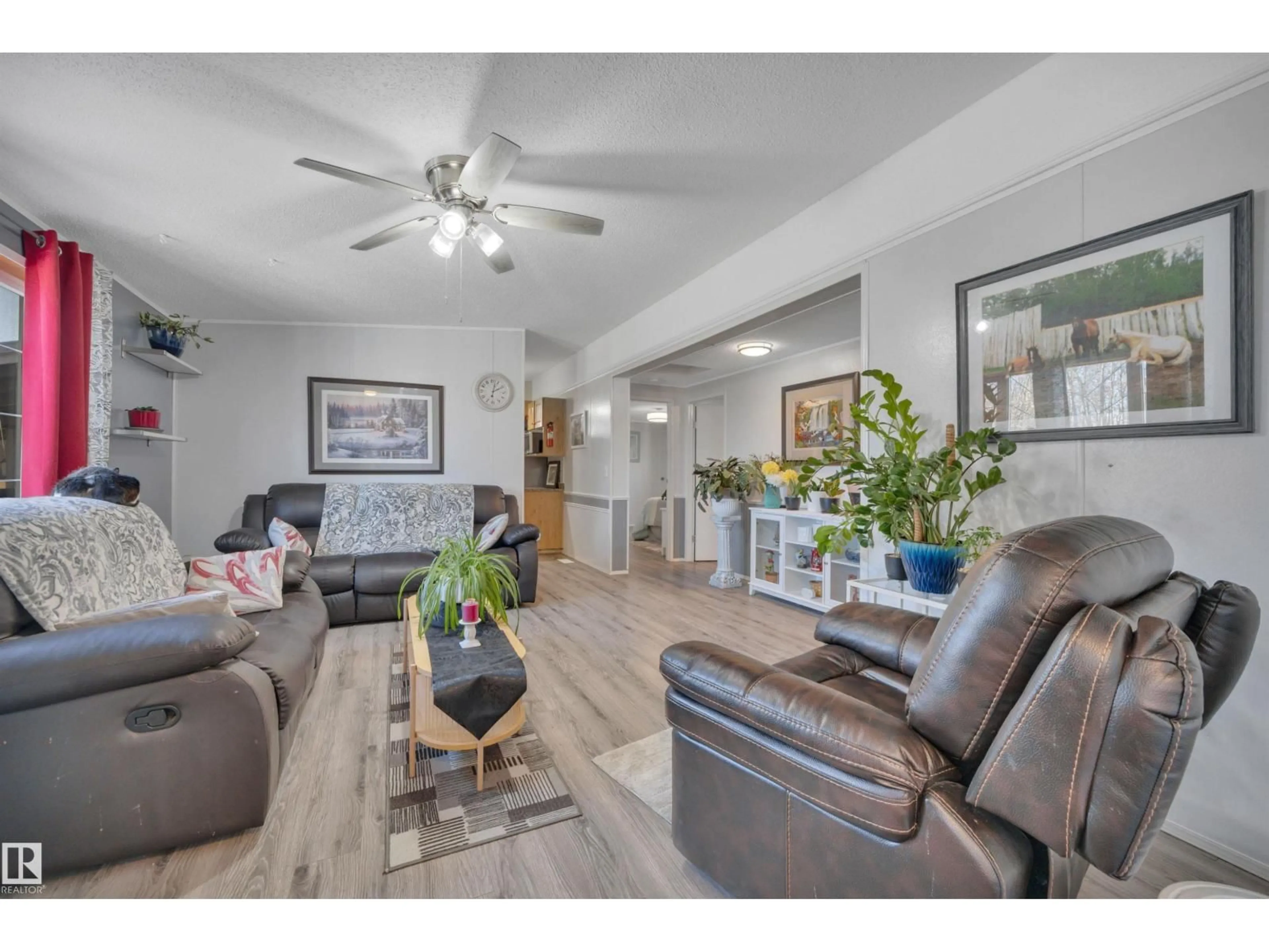 Living room with furniture, wood/laminate floor for 471020 RGE ROAD 242, Rural Wetaskiwin County Alberta T9A1X1