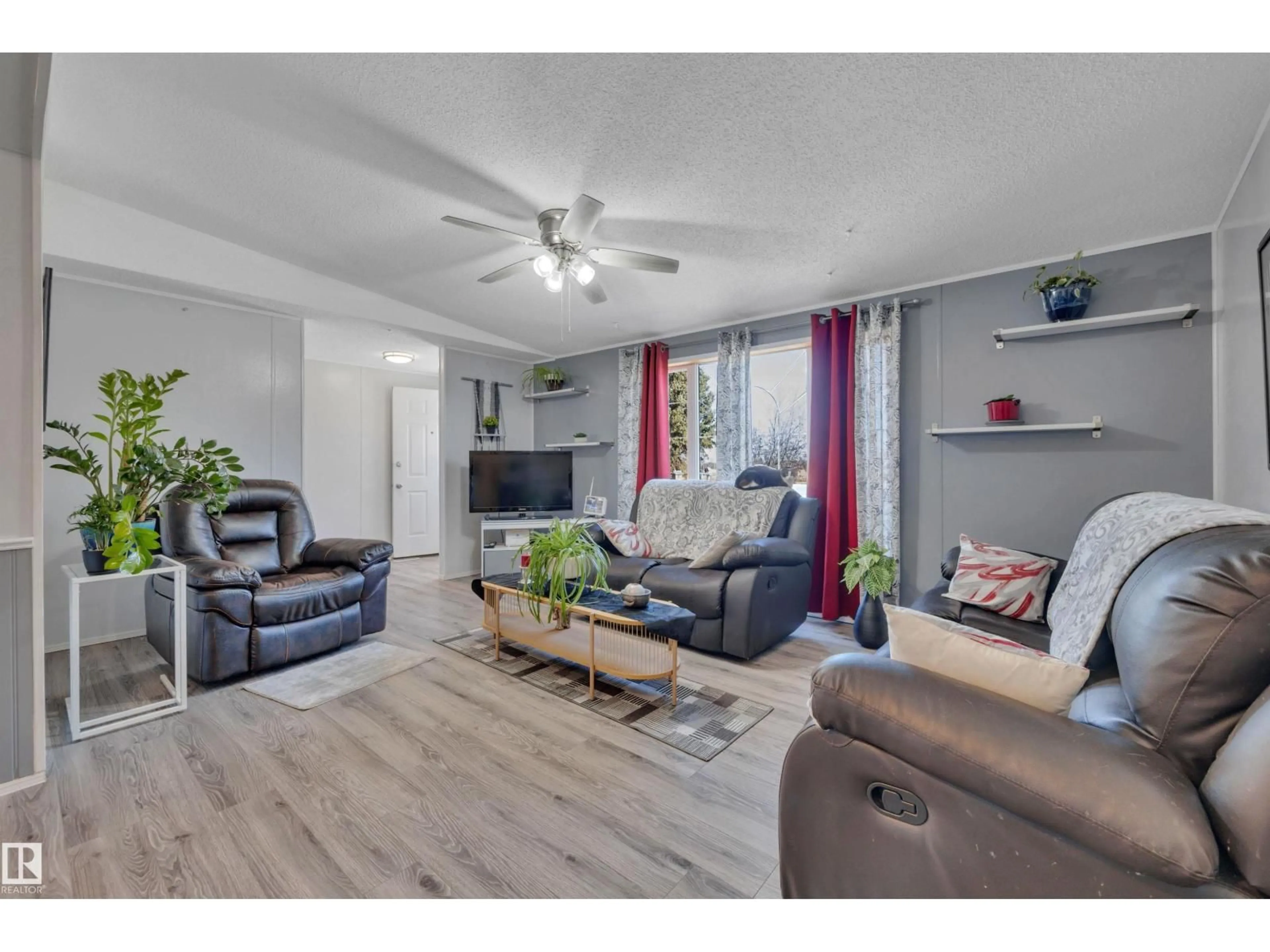 Living room with furniture, wood/laminate floor for 471020 RGE ROAD 242, Rural Wetaskiwin County Alberta T9A1X1