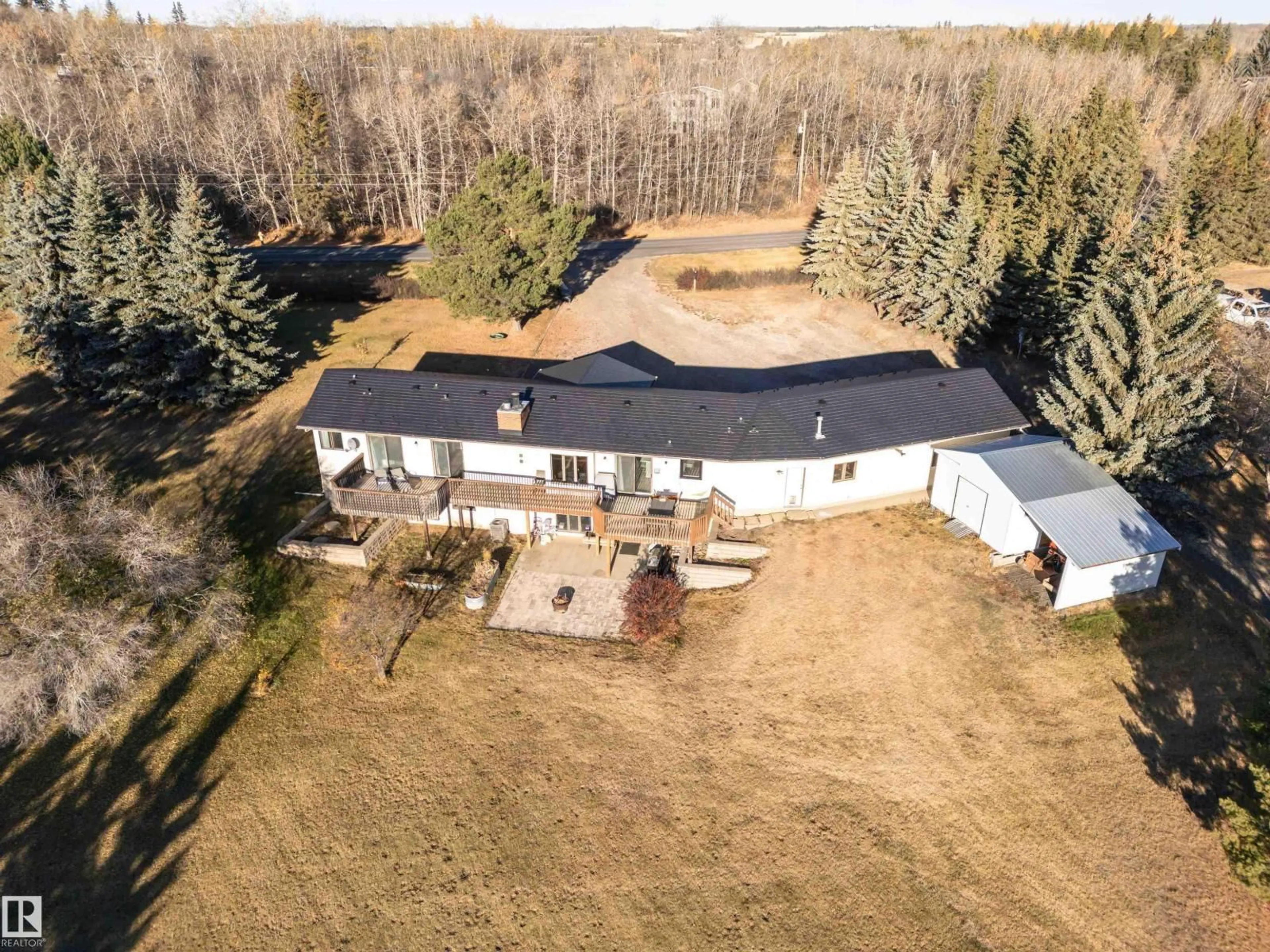 A pic from outside/outdoor area/front of a property/back of a property/a pic from drone, building for 21 - 55517 RR 240, Rural Sturgeon County Alberta T5E5S7