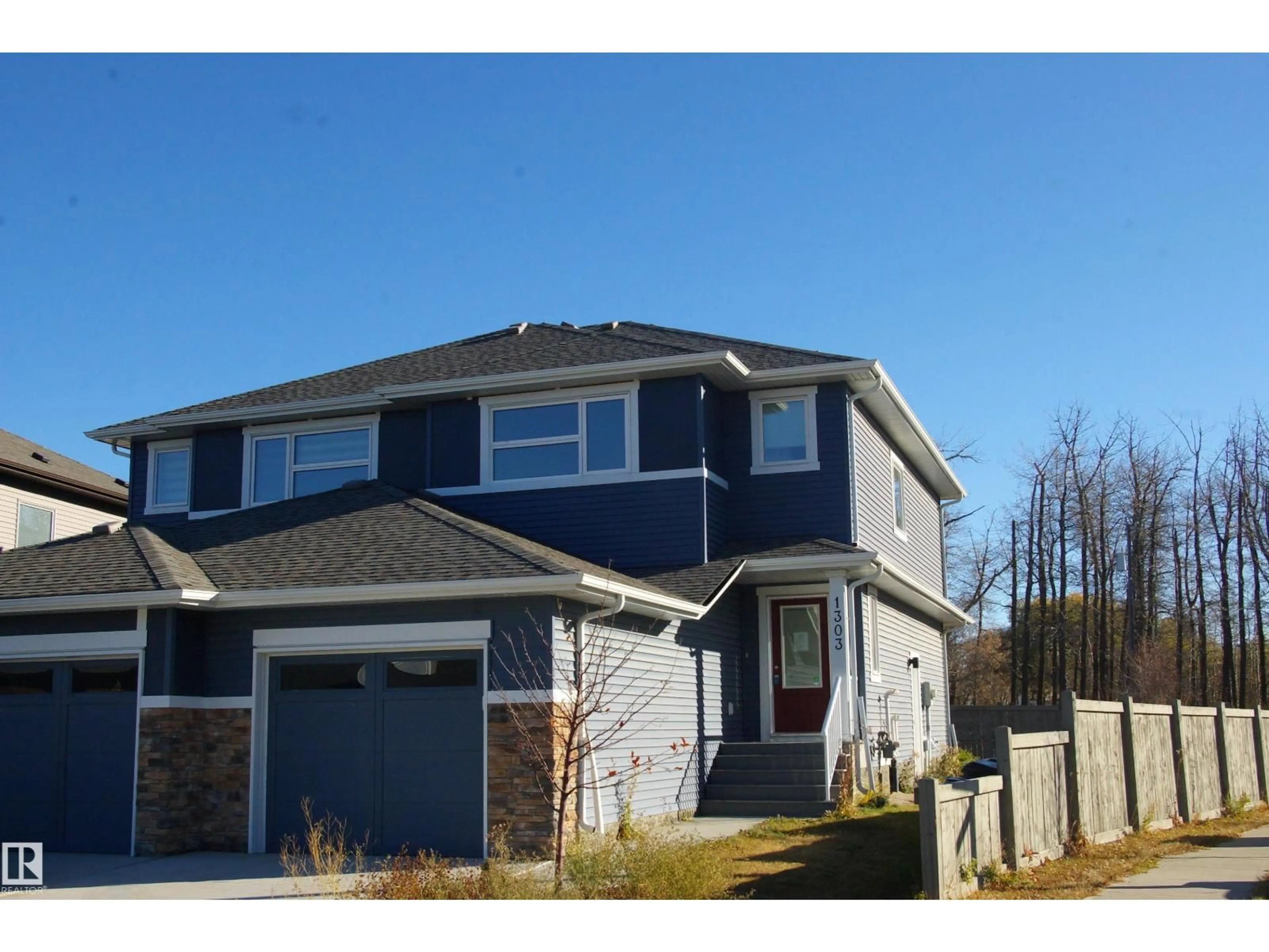 Home with vinyl exterior material, street for 1303 ERKER CR, Edmonton Alberta T6M1N4