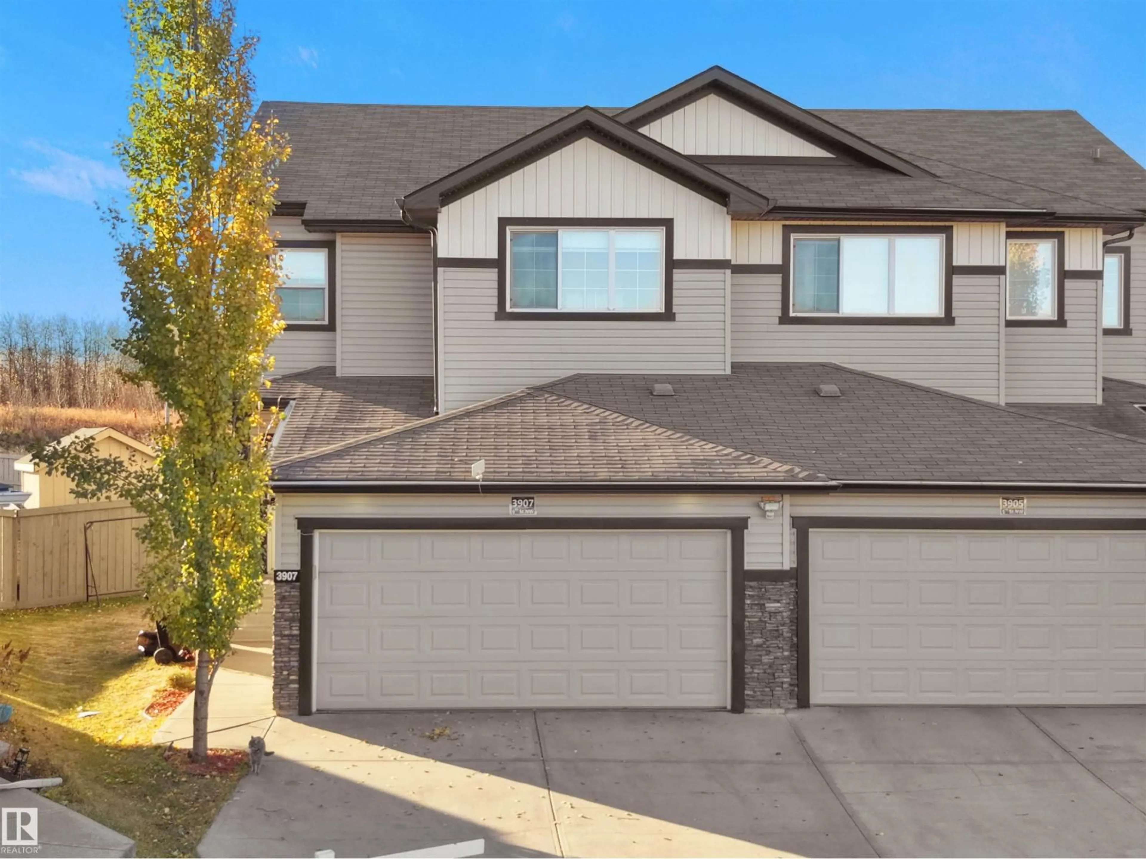 Home with vinyl exterior material, street for NW - 3907 6 ST, Edmonton Alberta T6T0T5