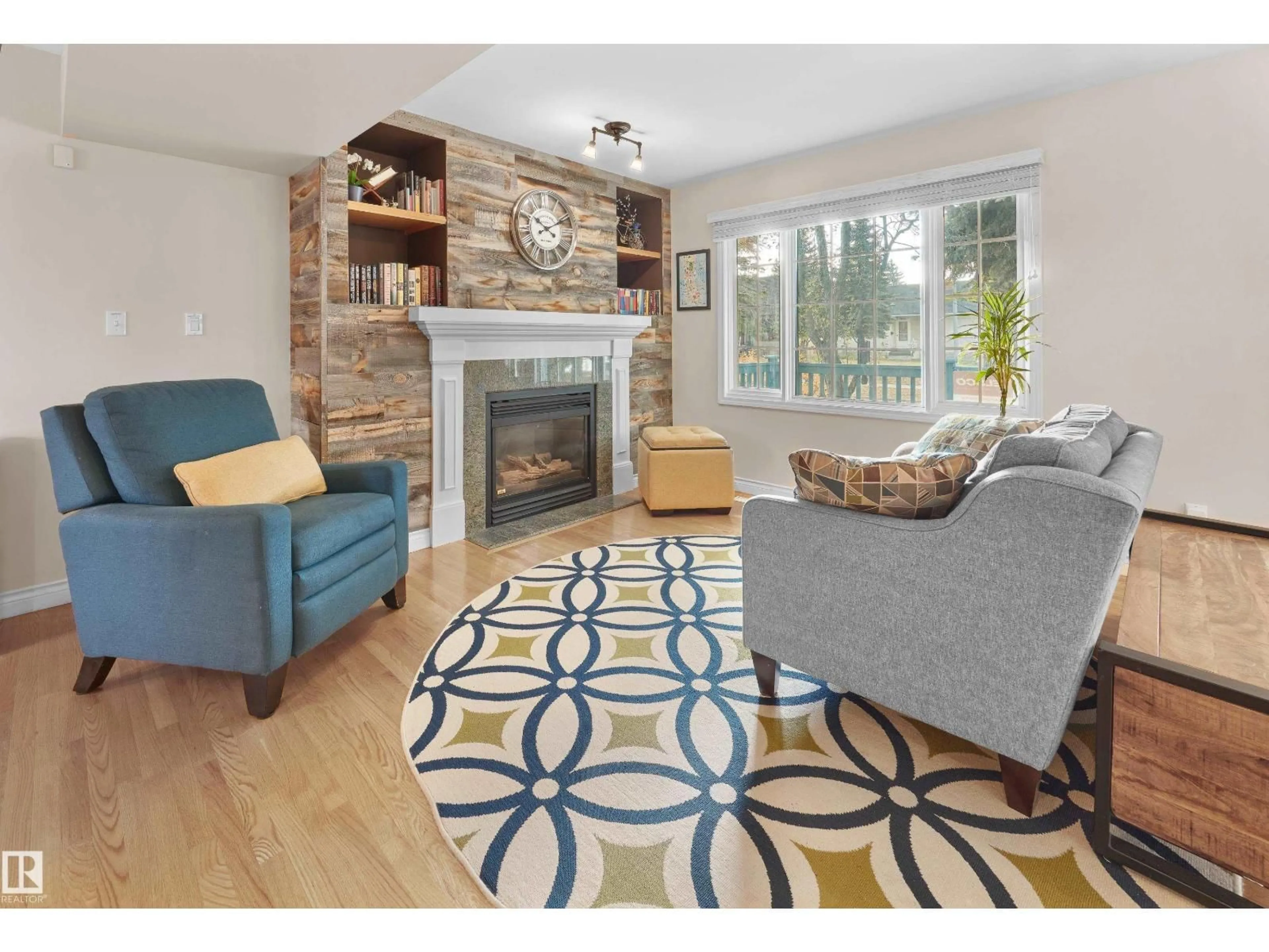 Living room with furniture, wood/laminate floor for 10690 63 AV, Edmonton Alberta T6H1P6