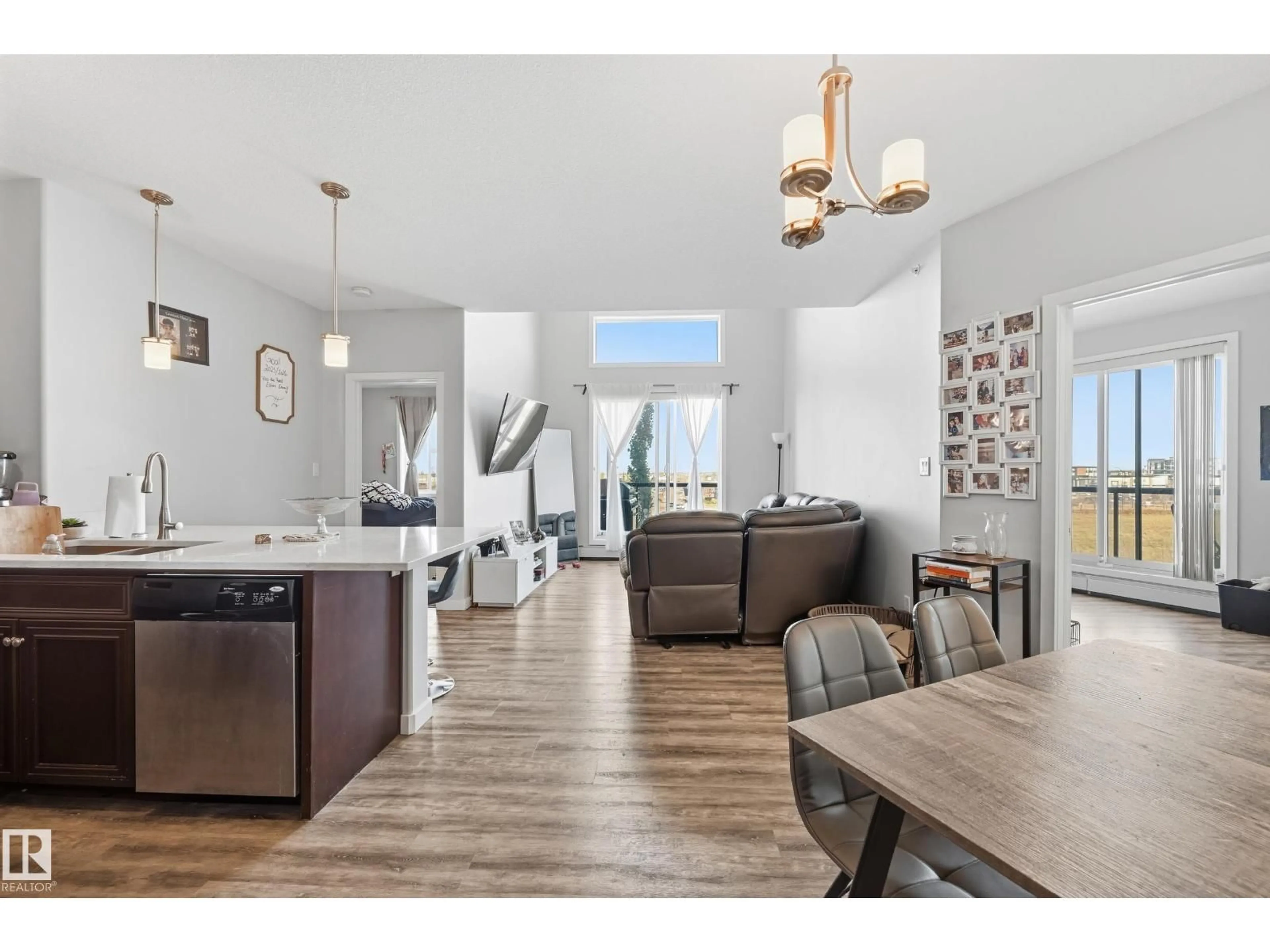 Open concept kitchen, wood/laminate floor for 304 - 411 AMBLESIDE LINK LI, Edmonton Alberta T6W0V2