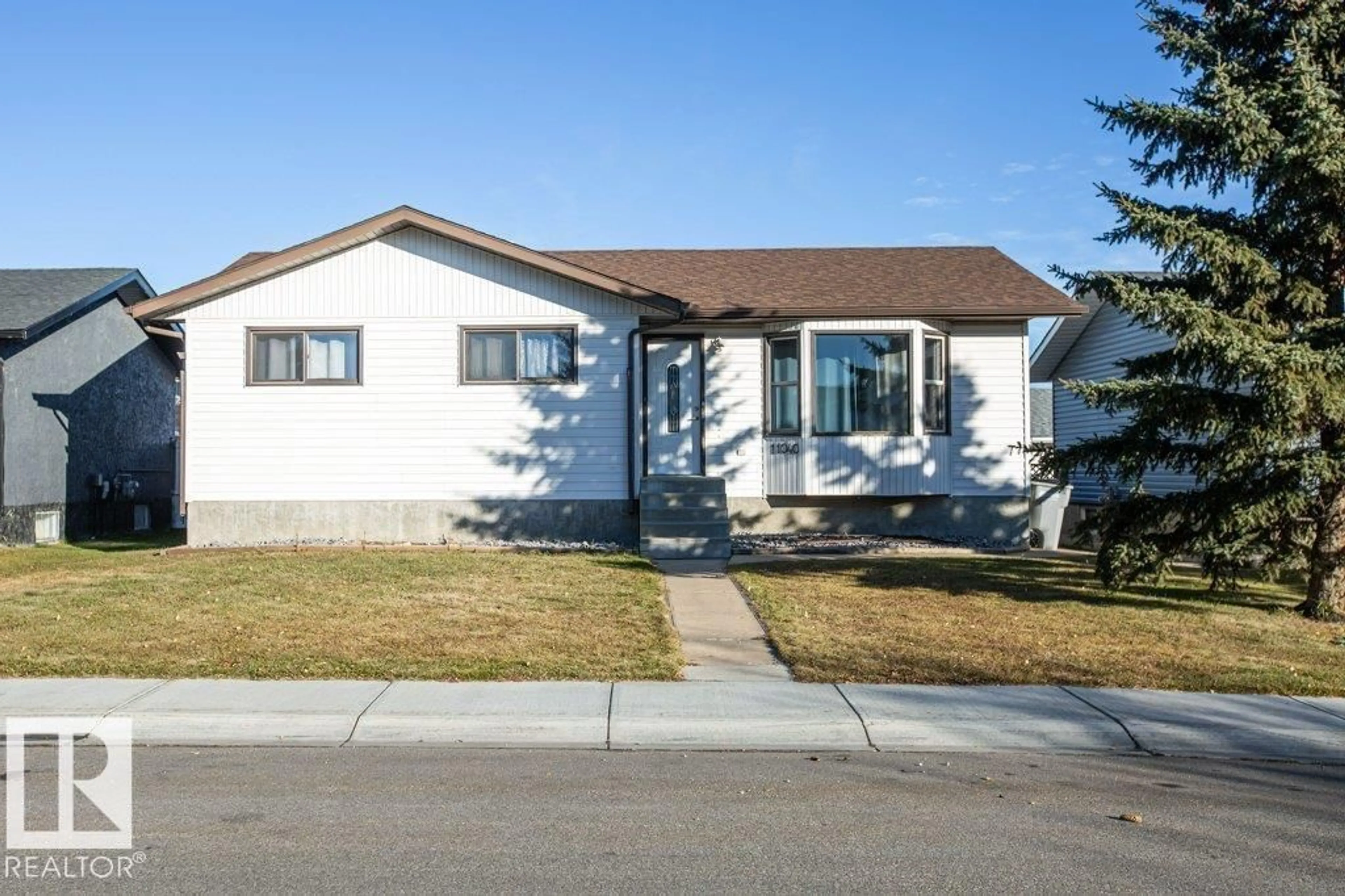 Home with vinyl exterior material, street for 11040 104 ST, Westlock Alberta T7P1G4
