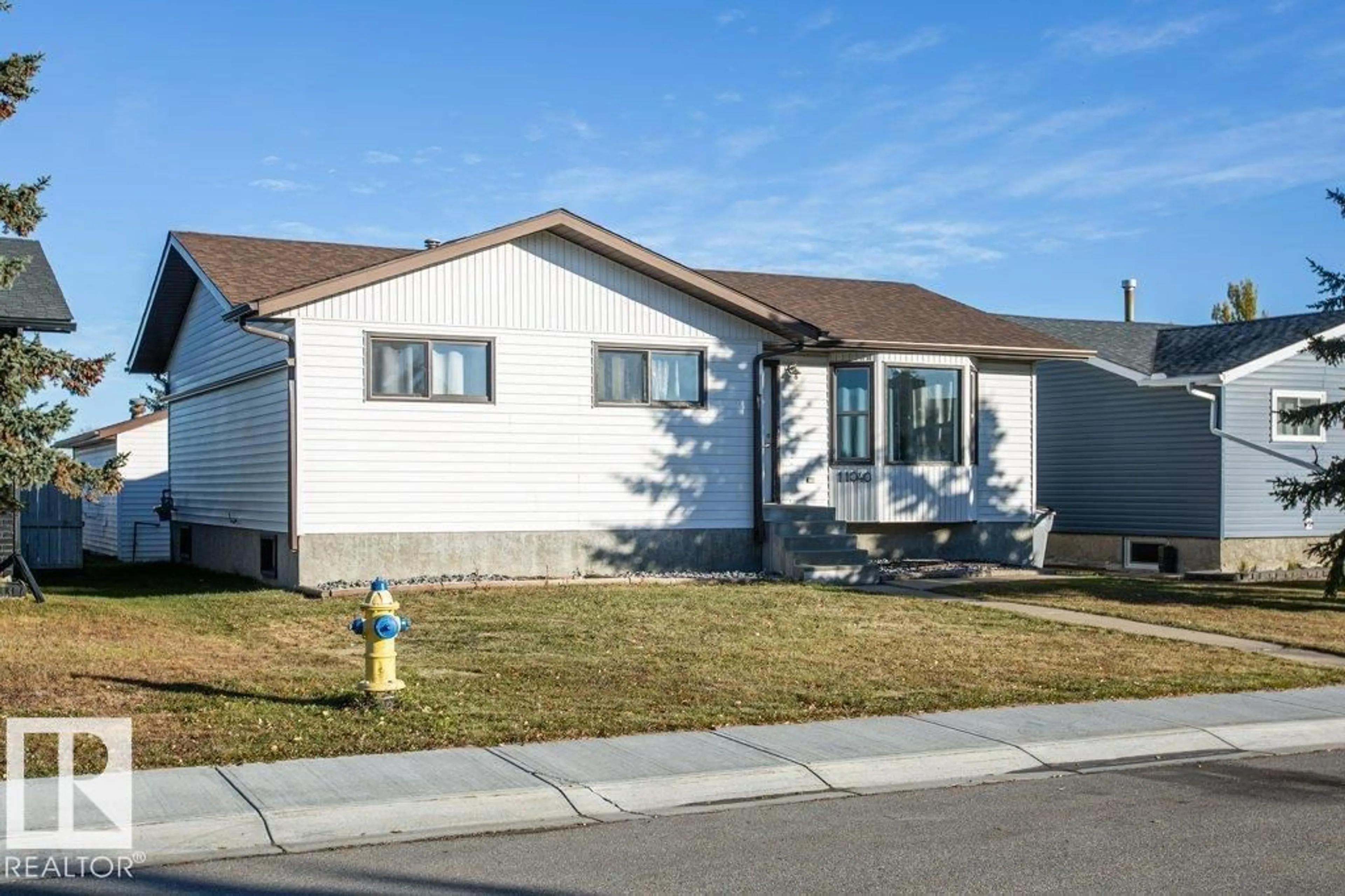 Home with vinyl exterior material, street for 11040 104 ST, Westlock Alberta T7P1G4