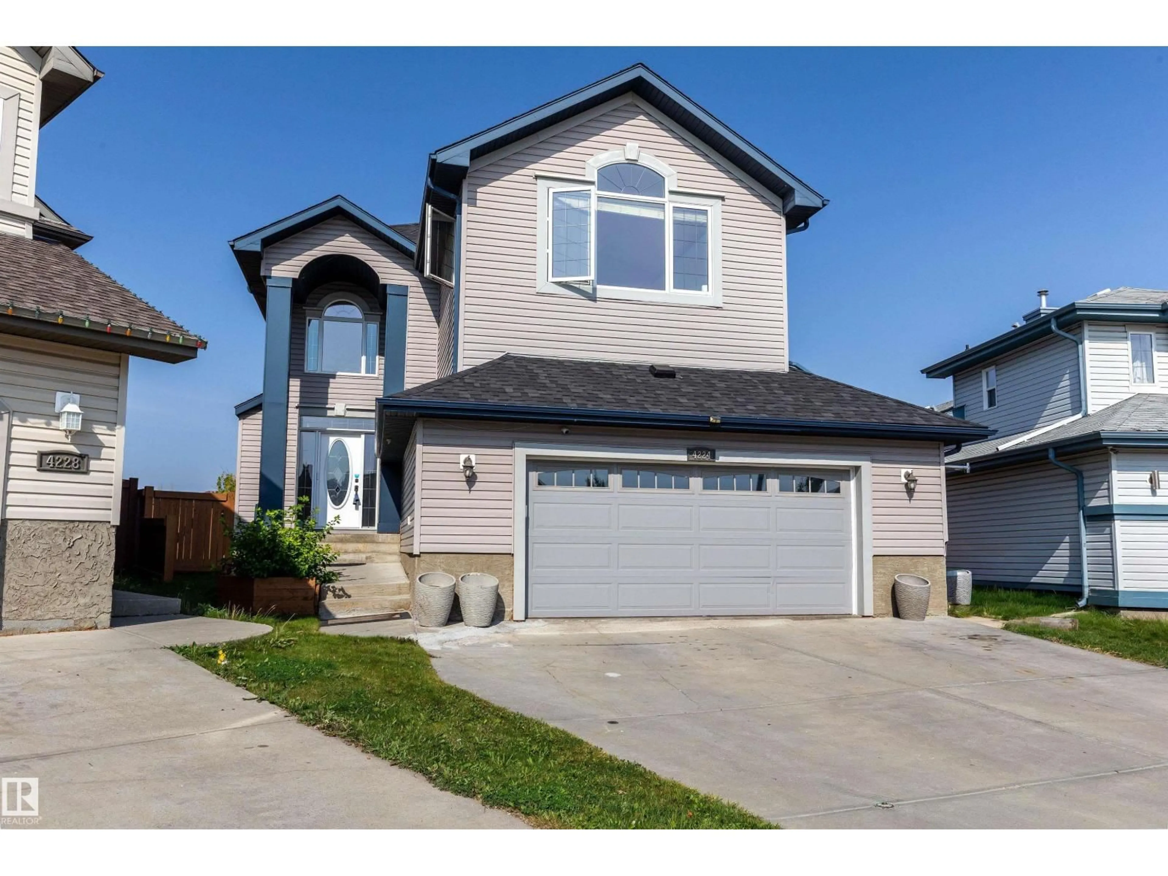 Home with vinyl exterior material, street for 4224 157 AV, Edmonton Alberta T5Y0C9