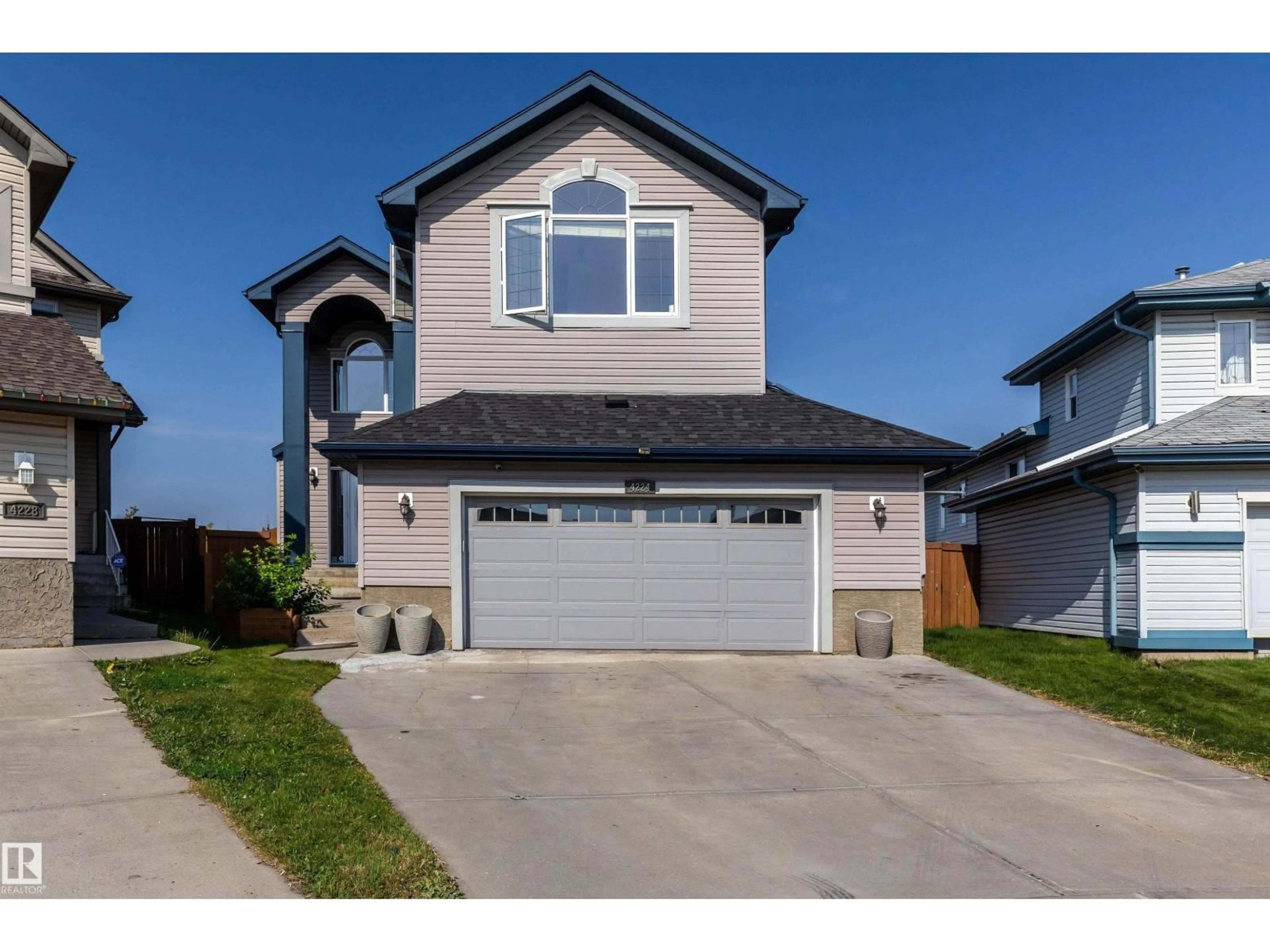 Home with vinyl exterior material, street for 4224 157 AV, Edmonton Alberta T5Y0C9