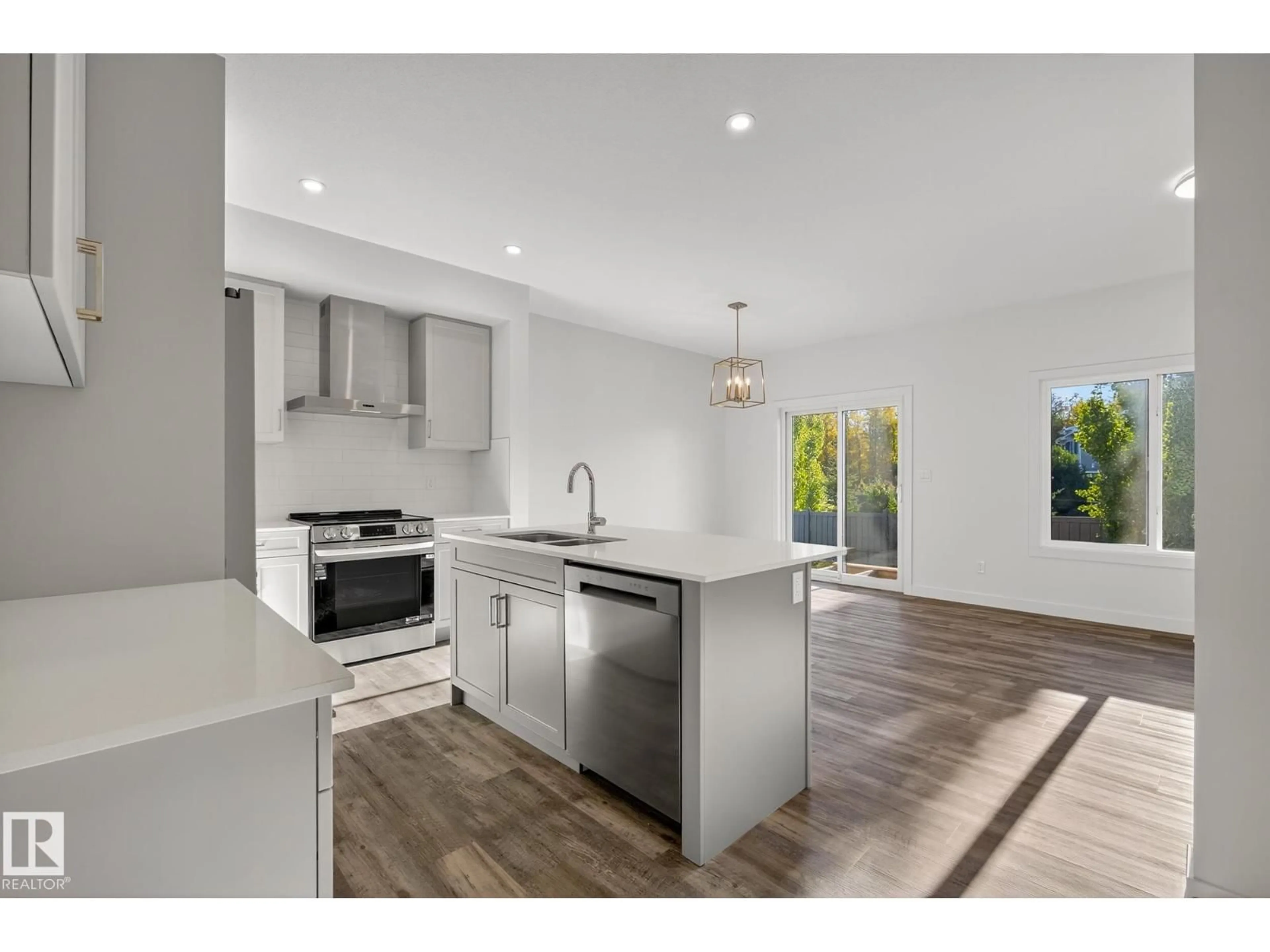 Open concept kitchen, wood/laminate floor for #5 - 5122 213A ST, Edmonton Alberta T6M0K7