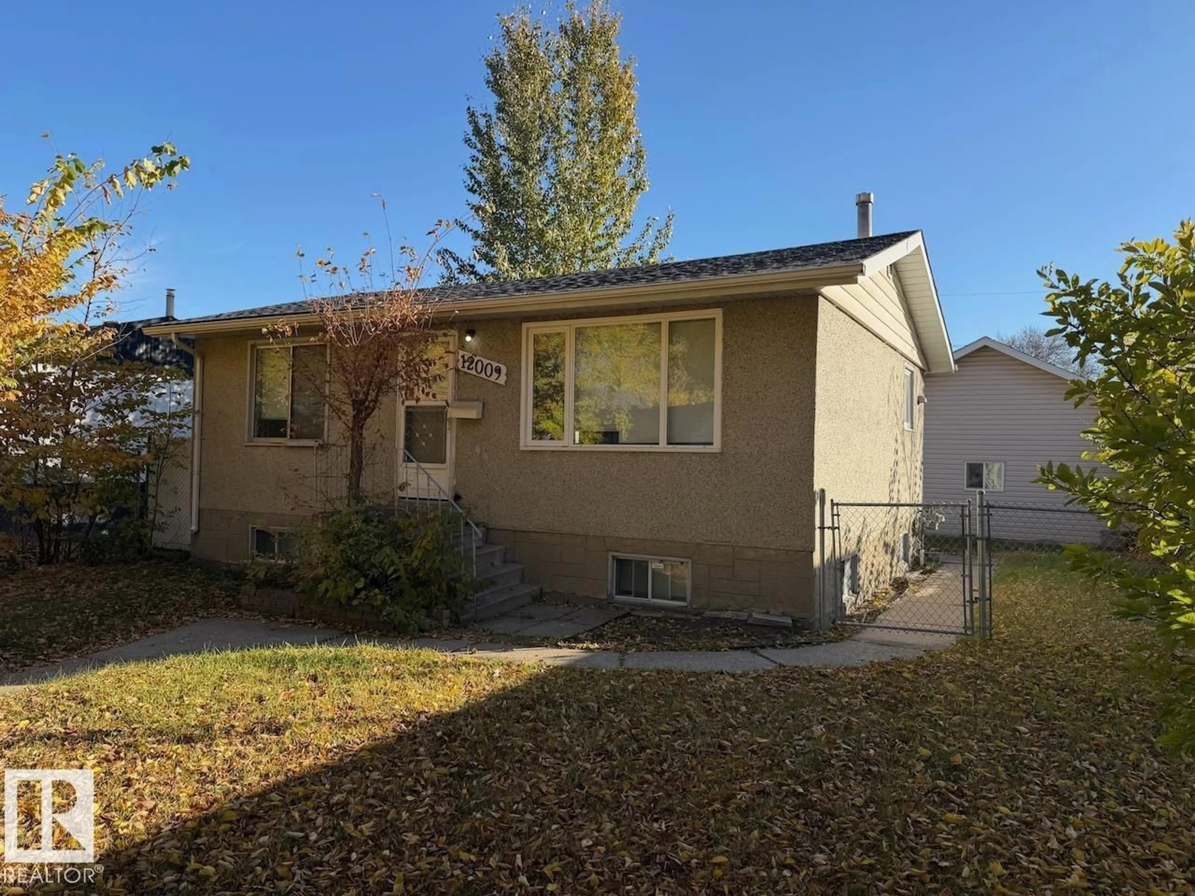 Home with vinyl exterior material, street for 12009 40 ST, Edmonton Alberta T5W2L2