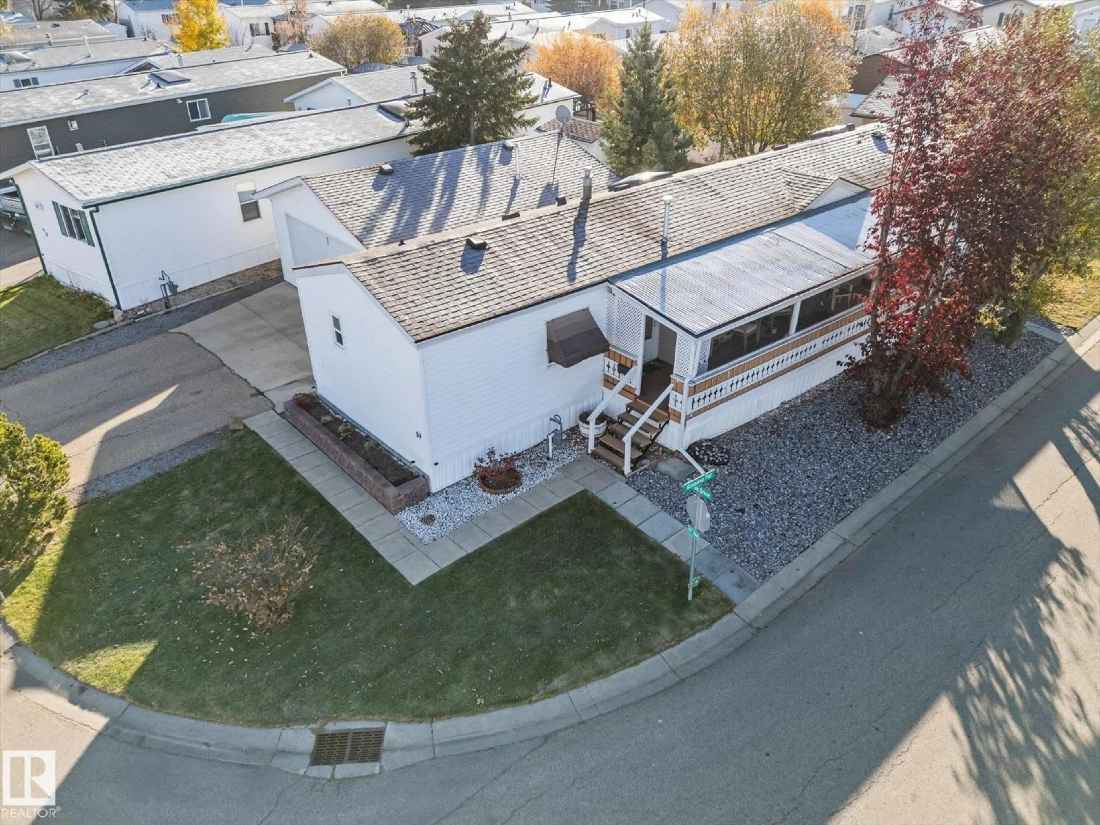 A pic from outside/outdoor area/front of a property/back of a property/a pic from drone, unknown for 89 3400 48 ST, Stony Plain Alberta T7Z1C1