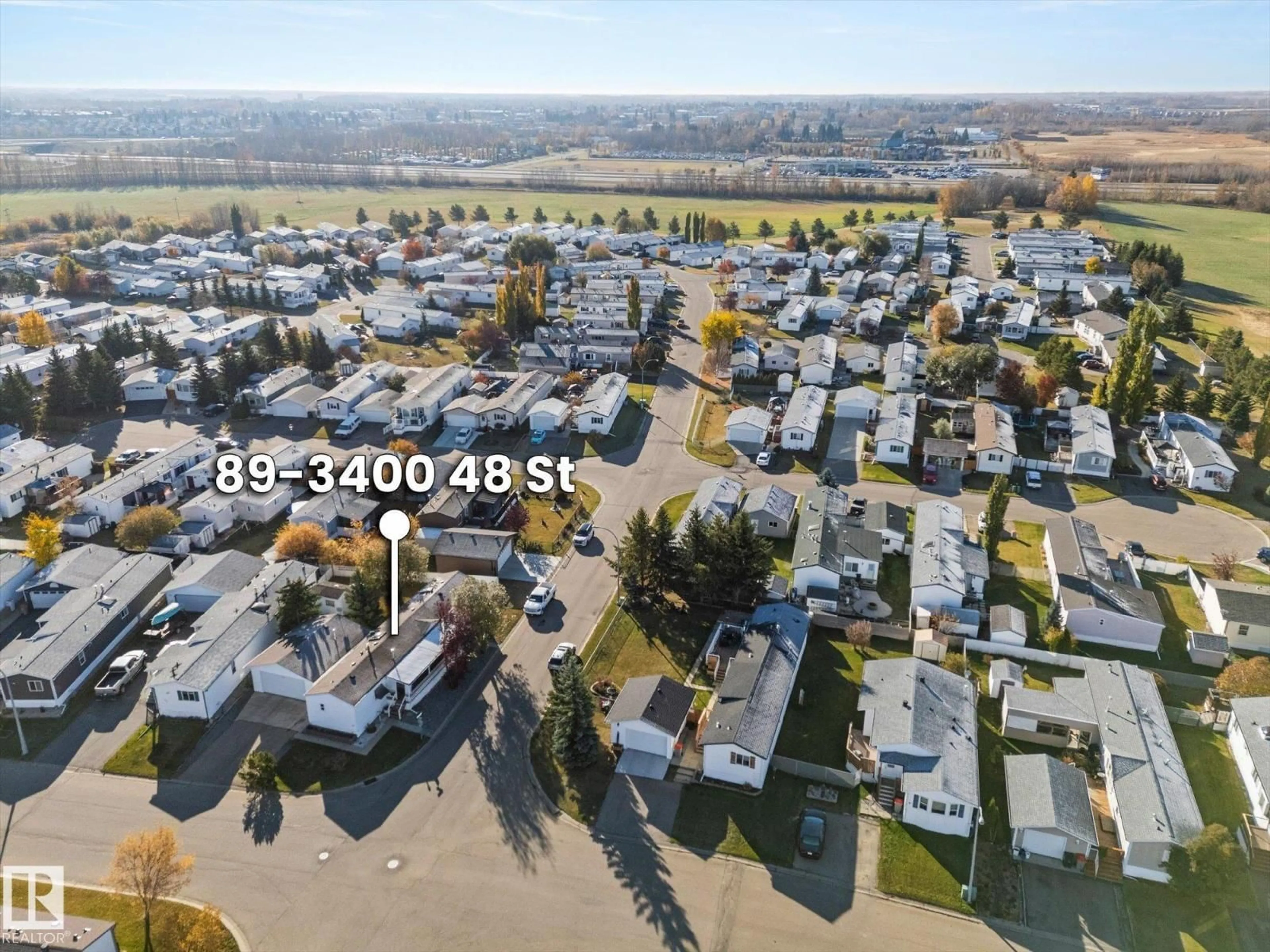 A pic from outside/outdoor area/front of a property/back of a property/a pic from drone, street for 89 3400 48 ST, Stony Plain Alberta T7Z1C1