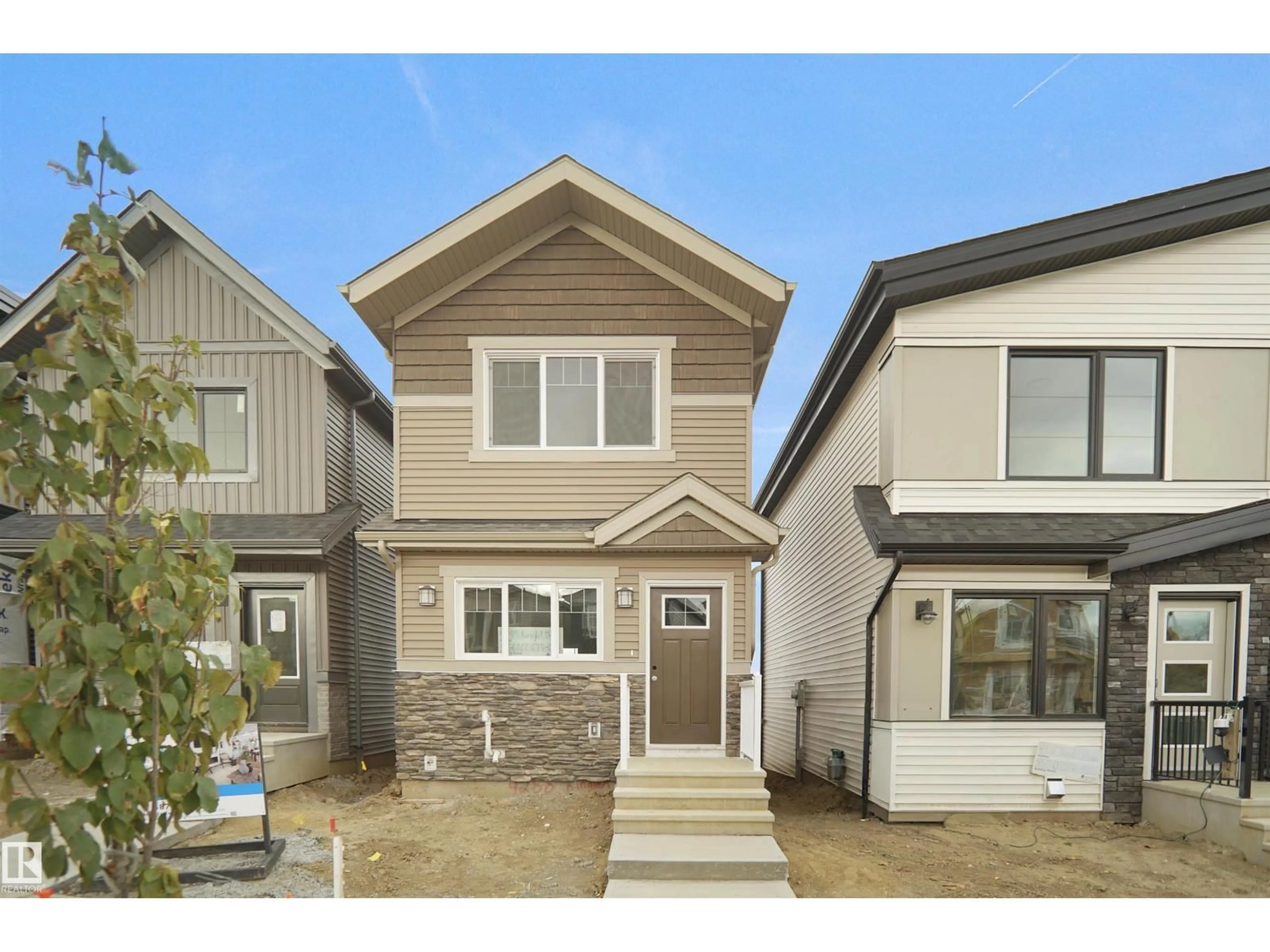 Home with vinyl exterior material, street for NW - 2103 210 ST, Edmonton Alberta T5S0T1