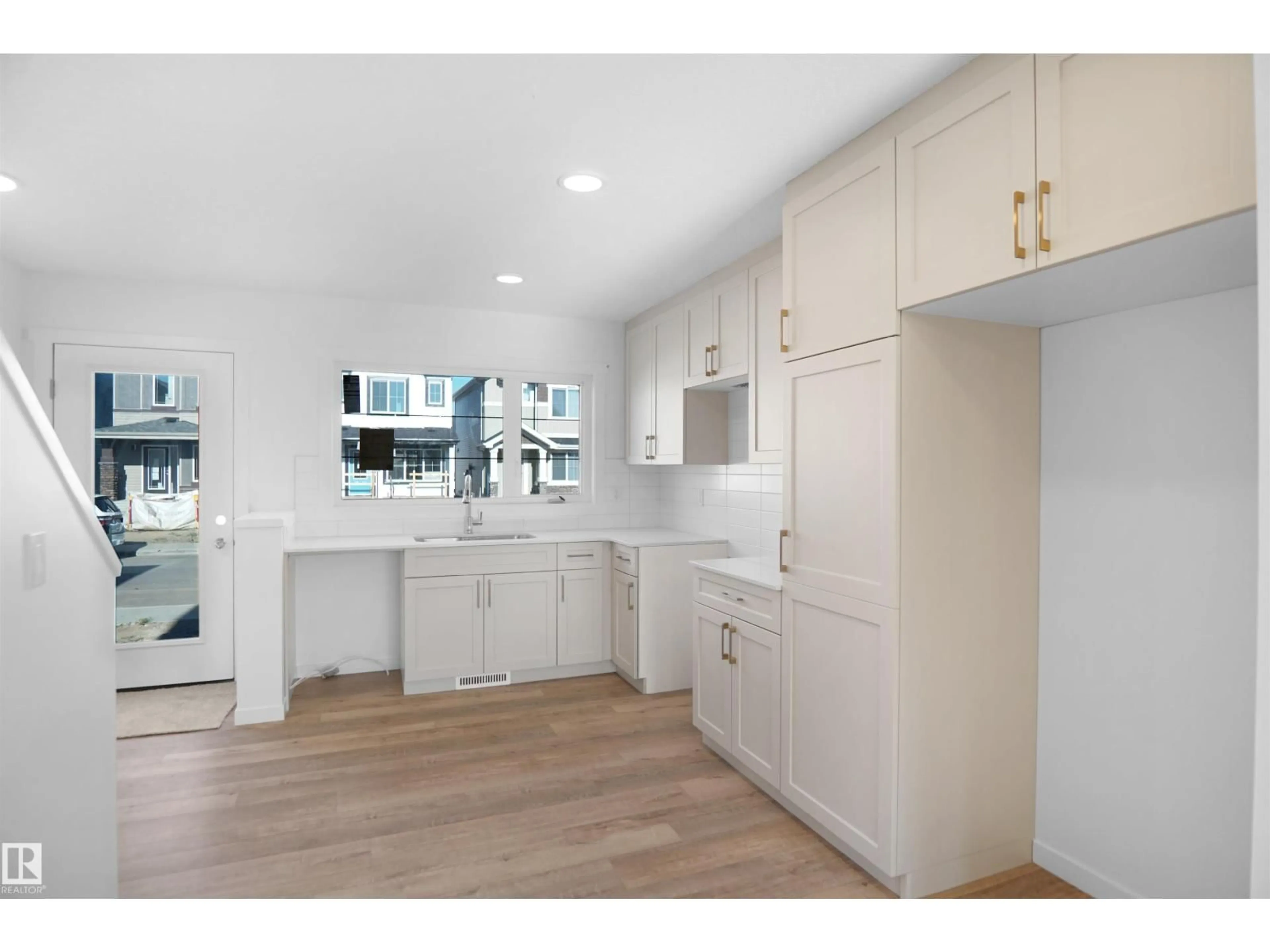 Open concept kitchen, unknown for NW - 2103 210 ST, Edmonton Alberta T5S0T1