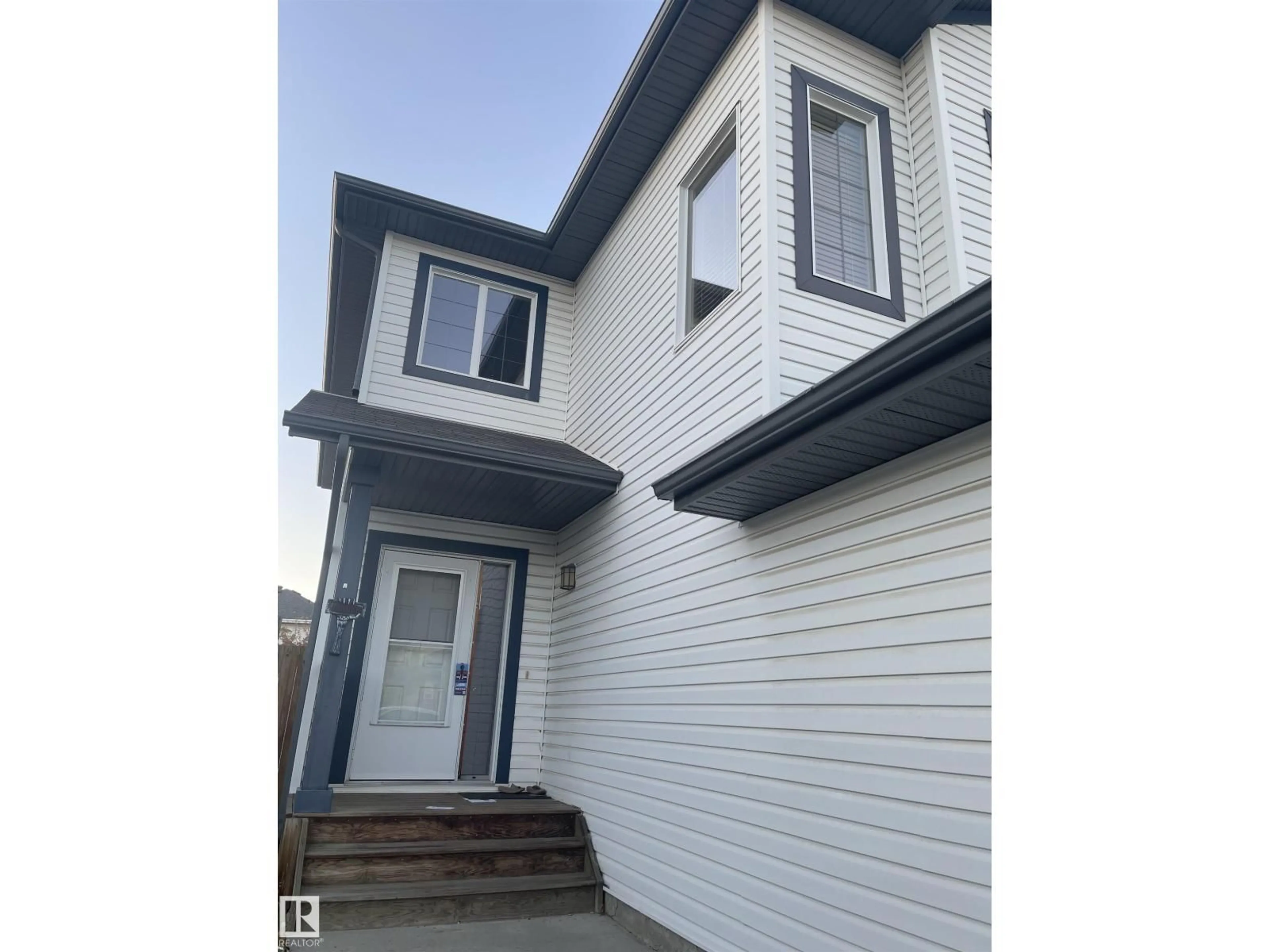 Home with vinyl exterior material, street for SW - 1436 114A ST, Edmonton Alberta T6W0N3