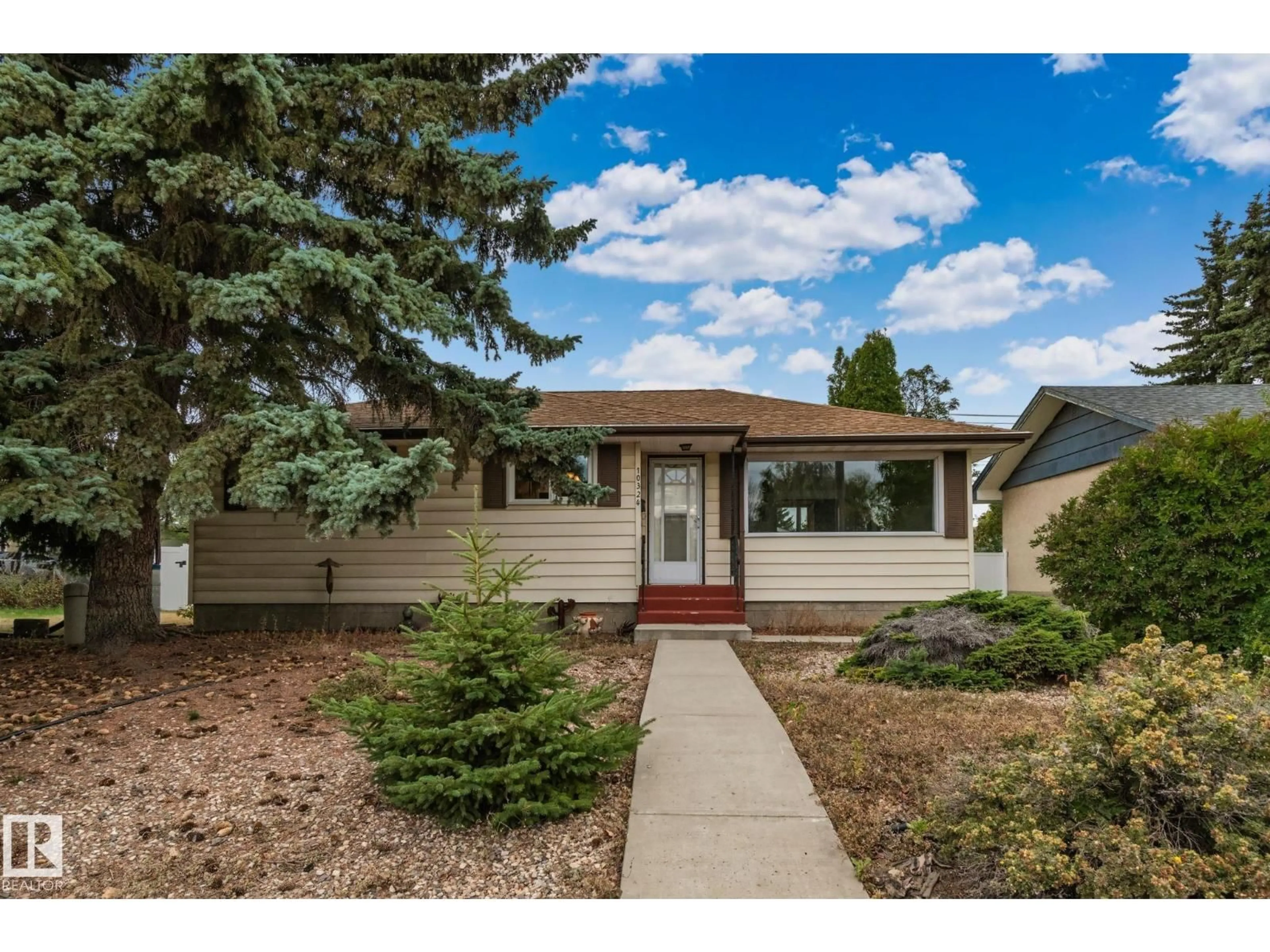 Home with vinyl exterior material, street for 10324 50 ST, Edmonton Alberta T6A2C4