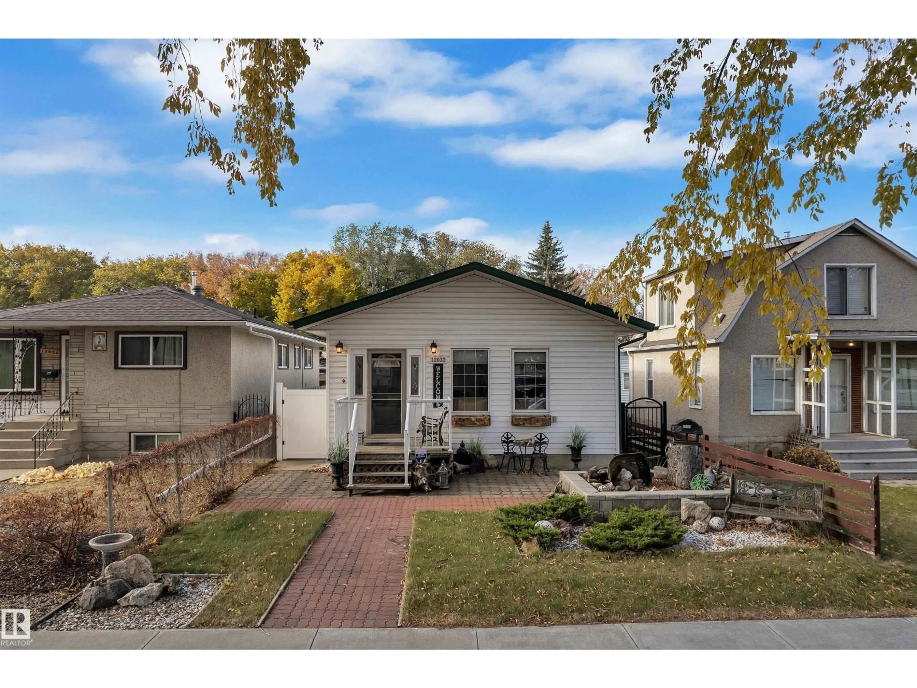 Home with vinyl exterior material, street for NW - 12032 56 ST, Edmonton Alberta T5W3T1