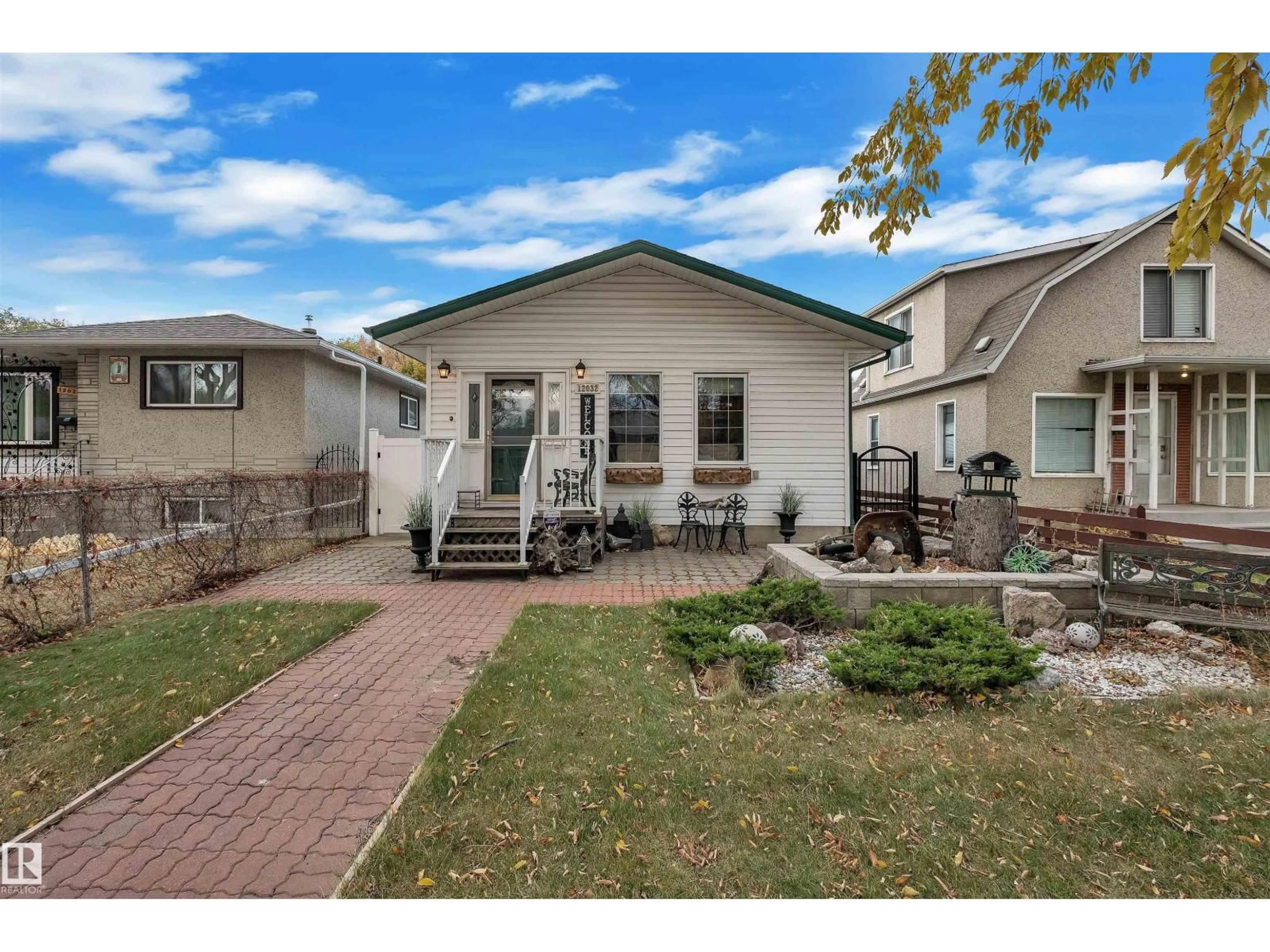 Home with vinyl exterior material, street for NW - 12032 56 ST, Edmonton Alberta T5W3T1