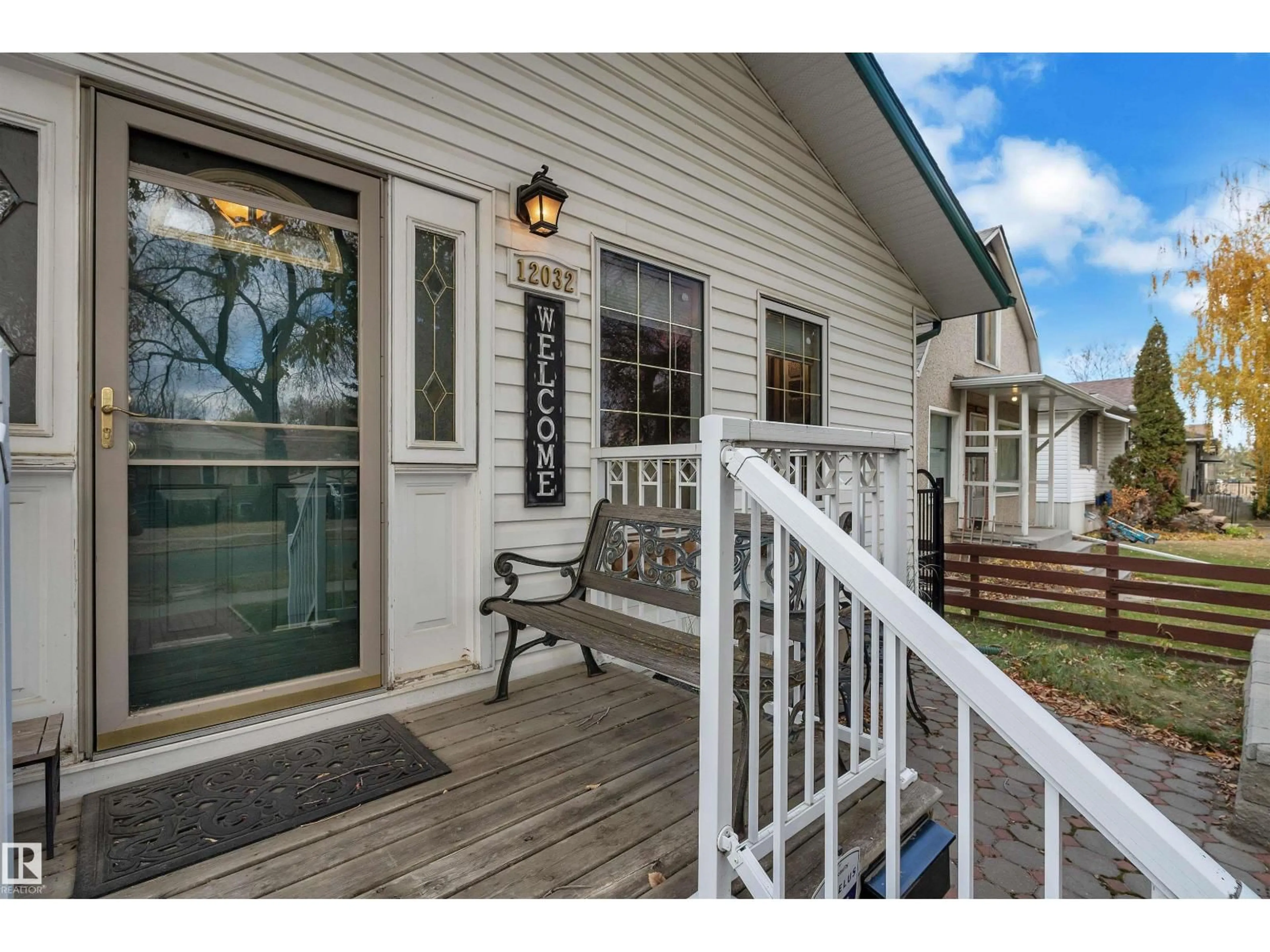 Home with vinyl exterior material, street for NW - 12032 56 ST, Edmonton Alberta T5W3T1