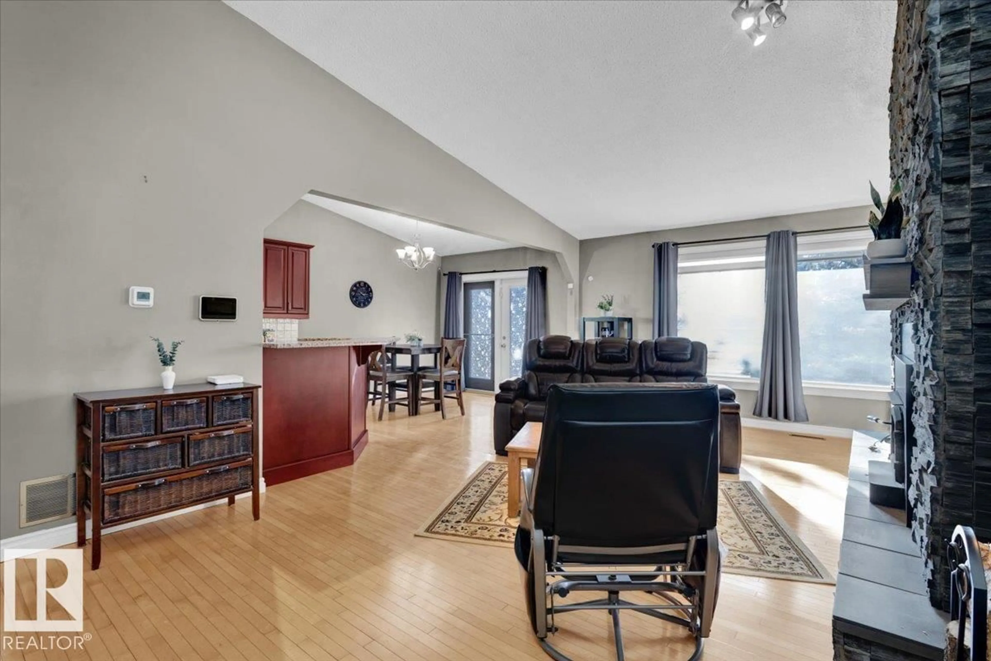 Living room with furniture, wood/laminate floor for 9403 62 ST, Edmonton Alberta T6B1P3