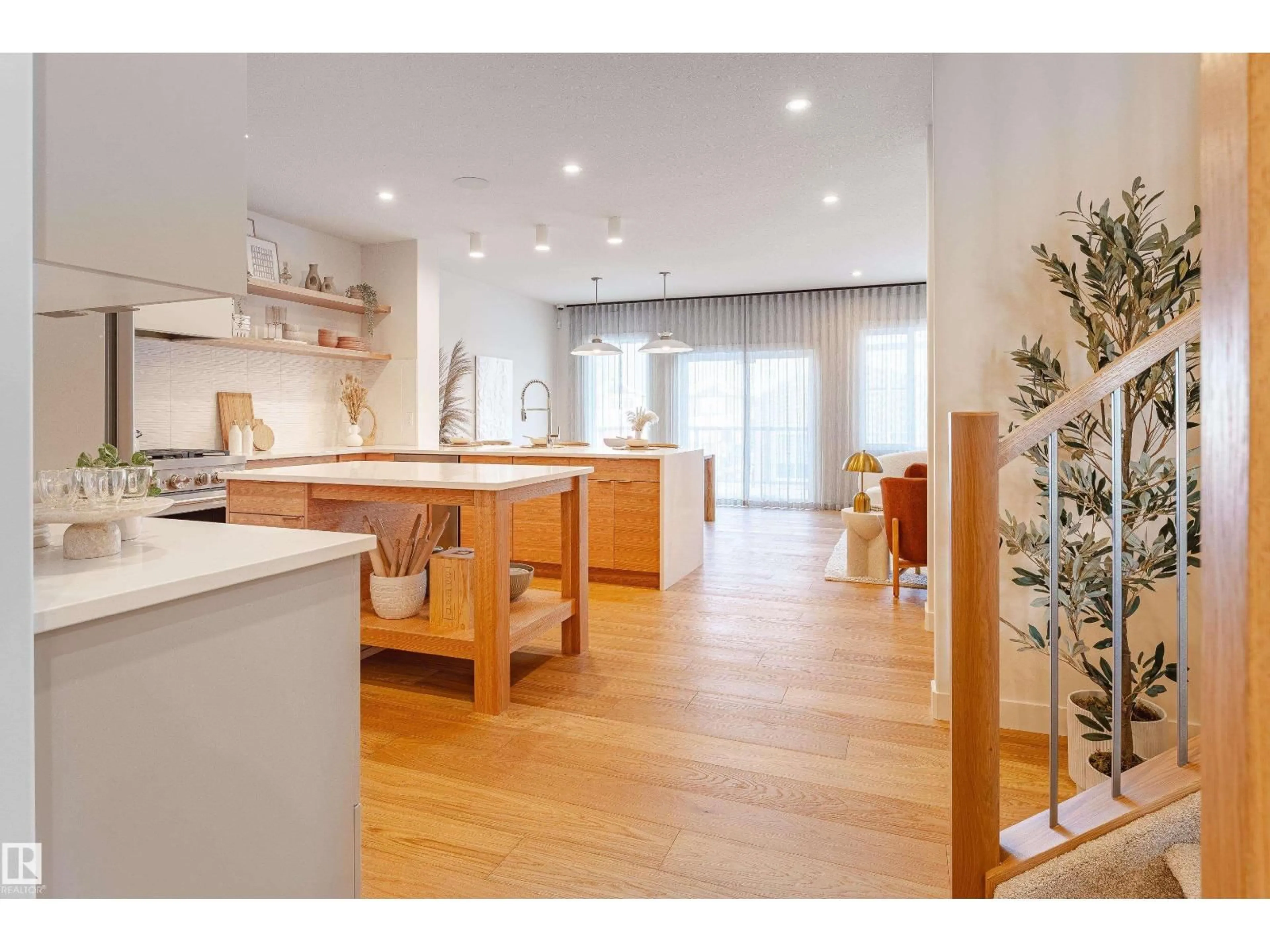Open concept kitchen, wood/laminate floor for GR SW - 4458 KINSELLA GREEN, Edmonton Alberta T6W5G2