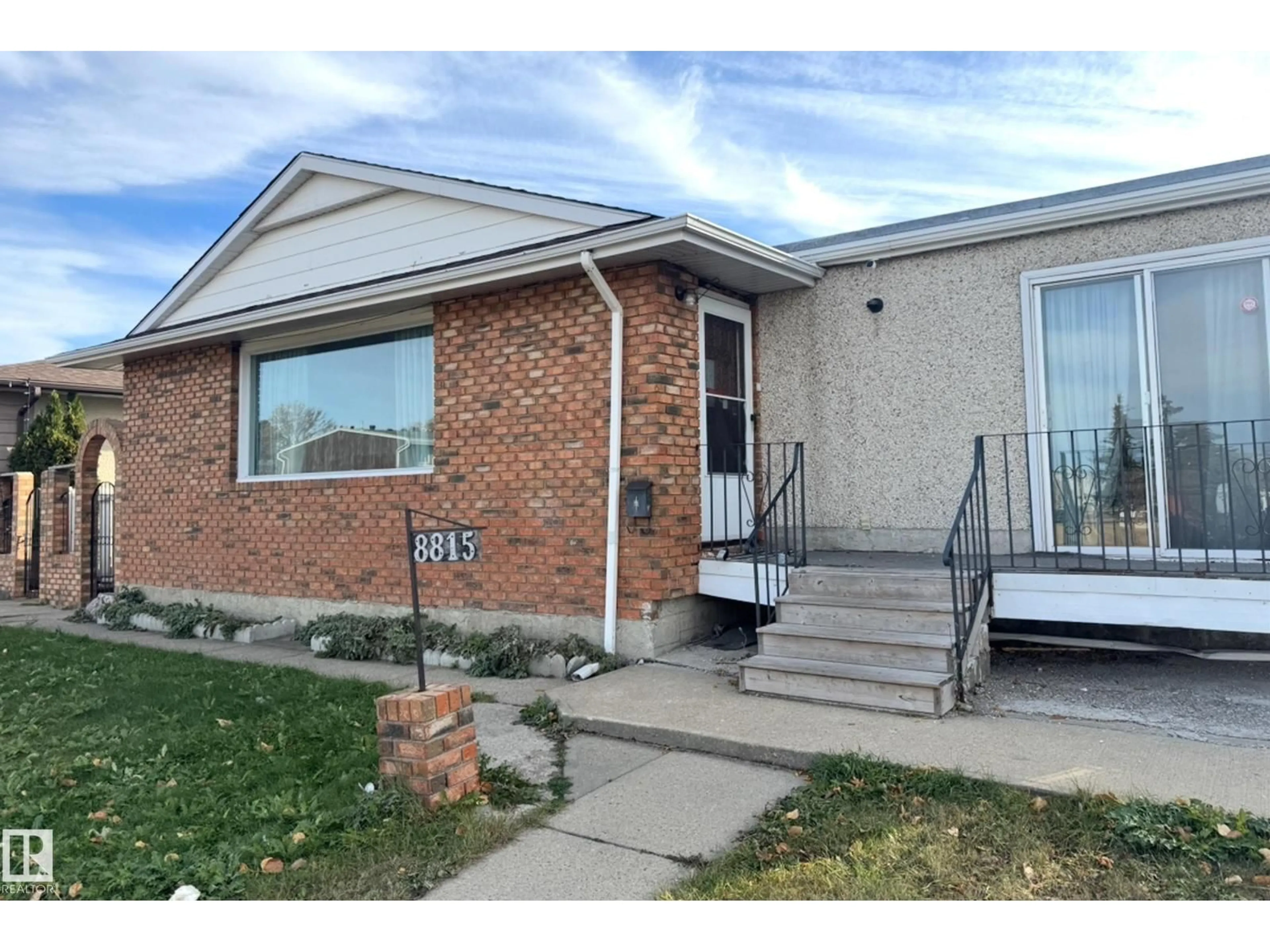 Home with brick exterior material, street for 8815 140 AV, Edmonton Alberta T5E2C8