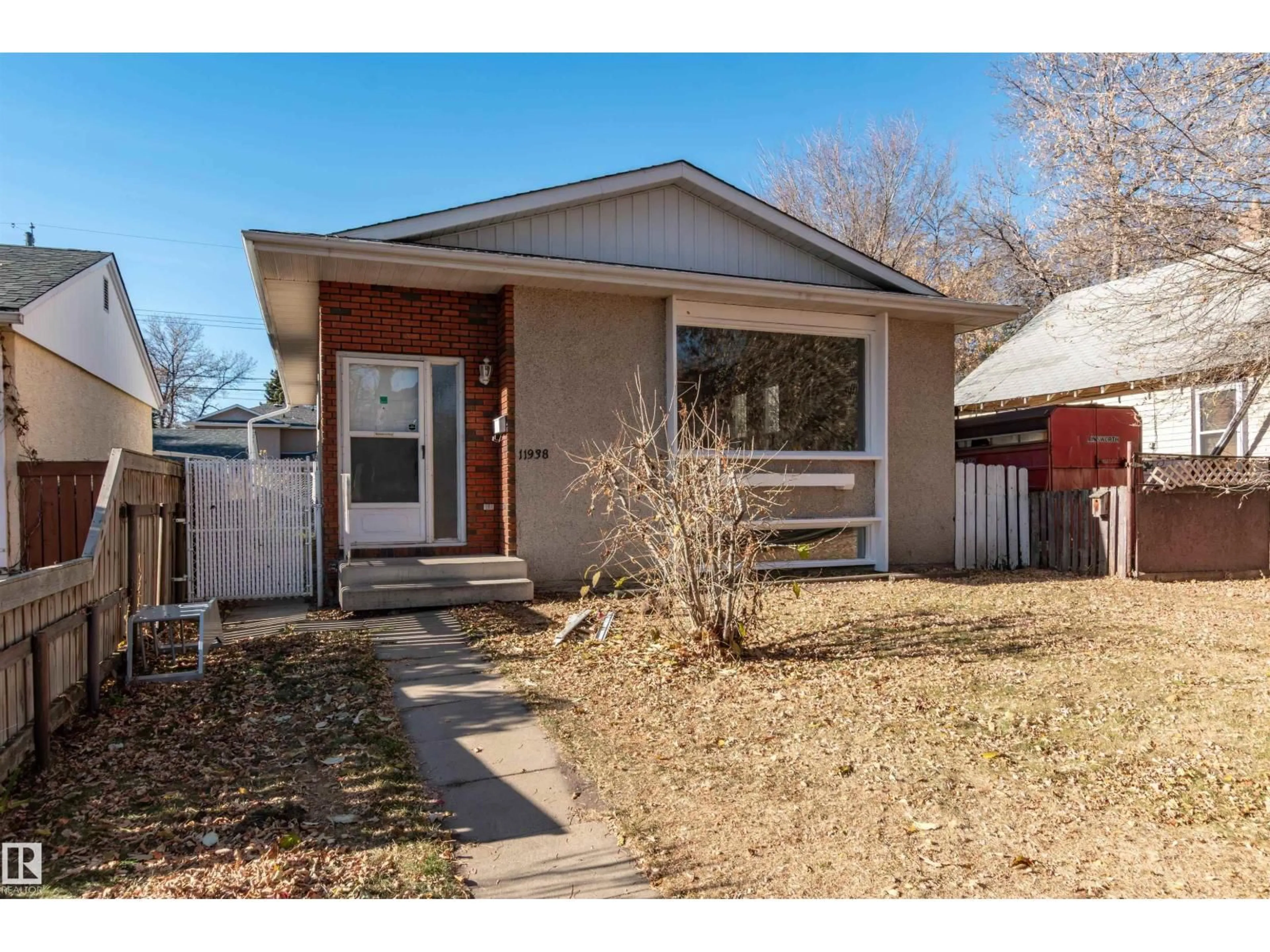 Home with brick exterior material, street for NW - 11938 43 ST, Edmonton Alberta T5W2P6