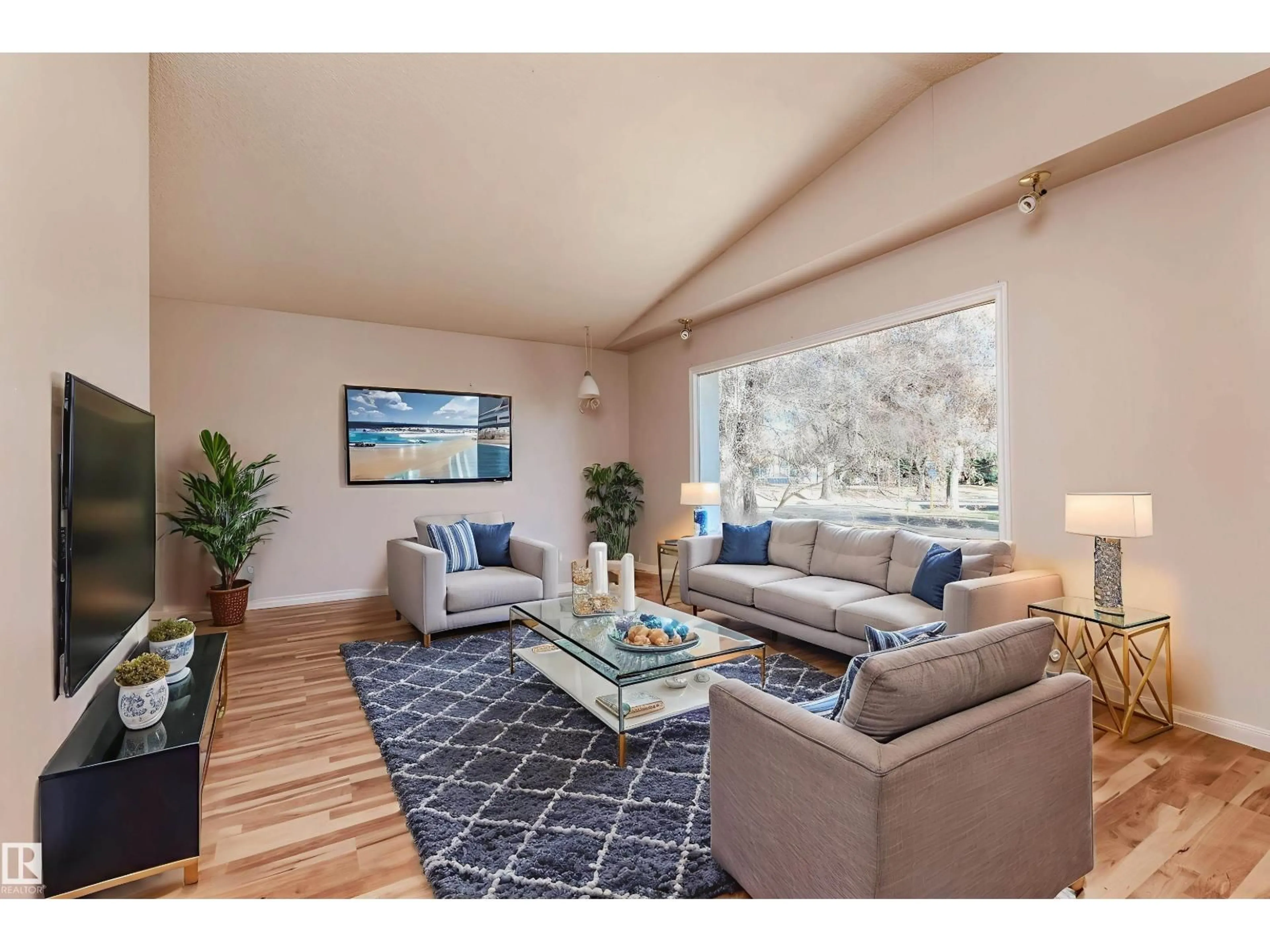 Living room with furniture, wood/laminate floor for NW - 11938 43 ST, Edmonton Alberta T5W2P6