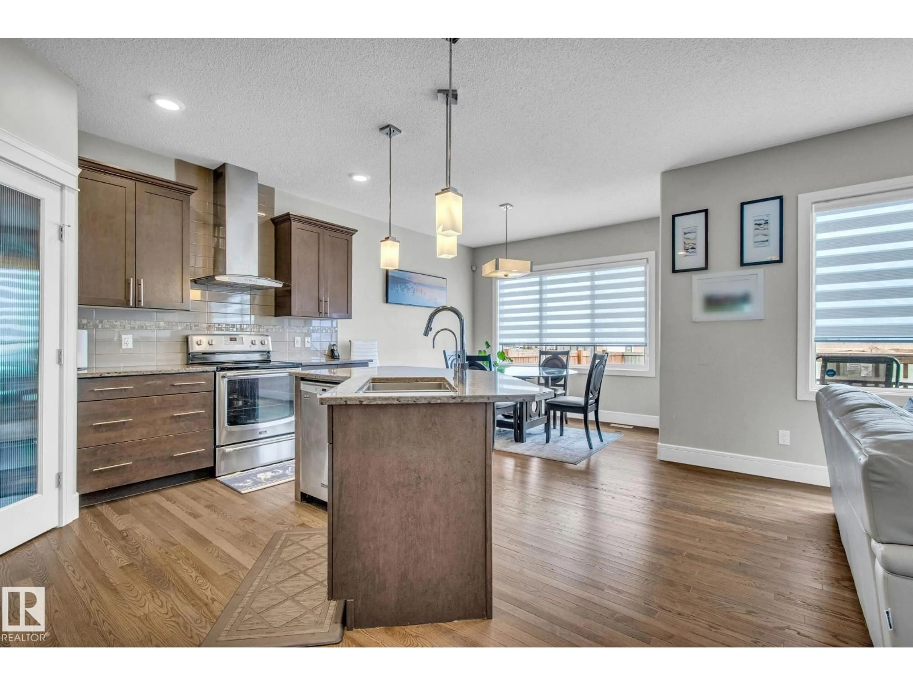 Open concept kitchen, unknown for 16404 12 AV, Edmonton Alberta T6W3K4