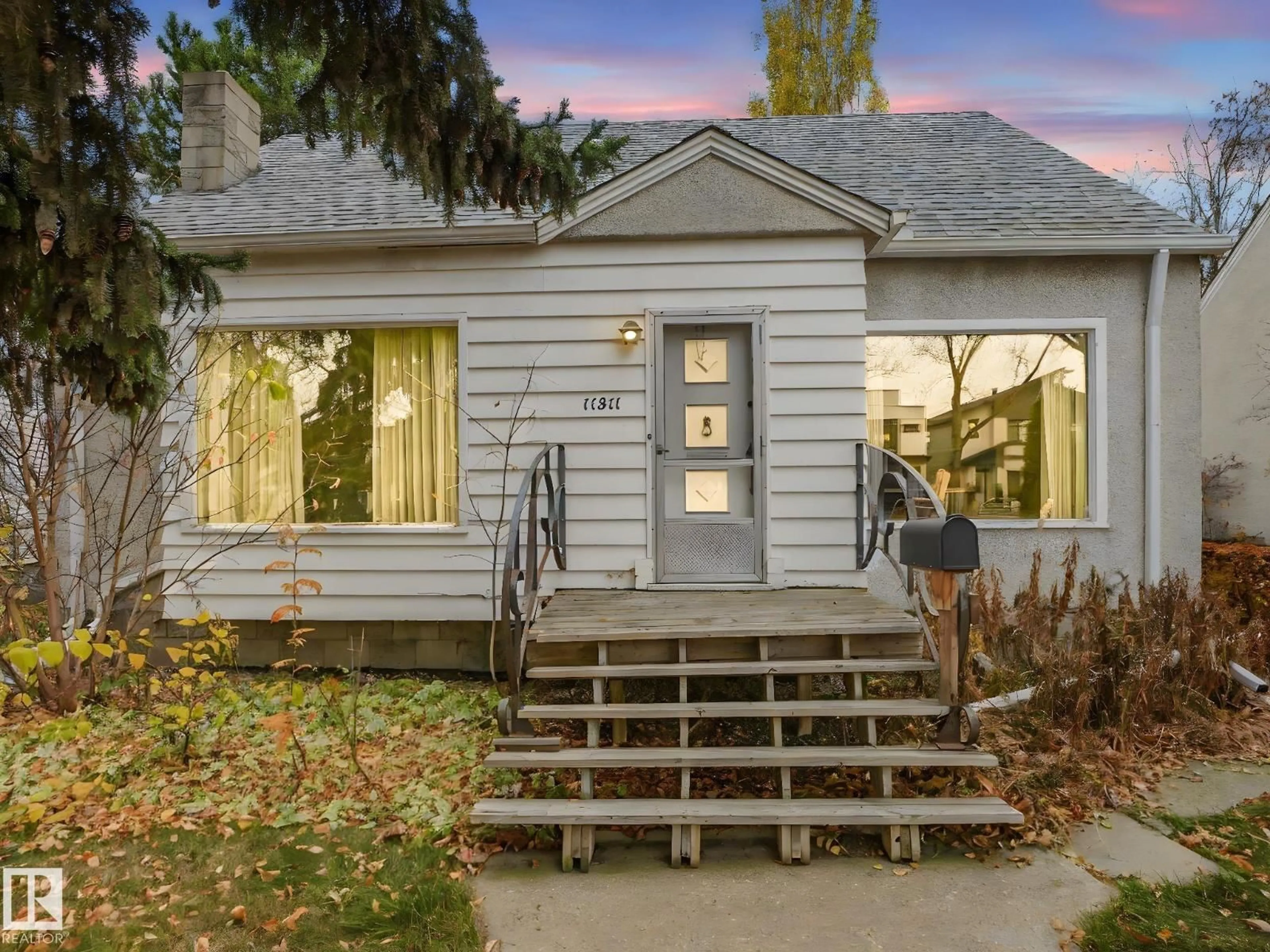 Home with vinyl exterior material, street for 11311 75 AV, Edmonton Alberta T6G0H6