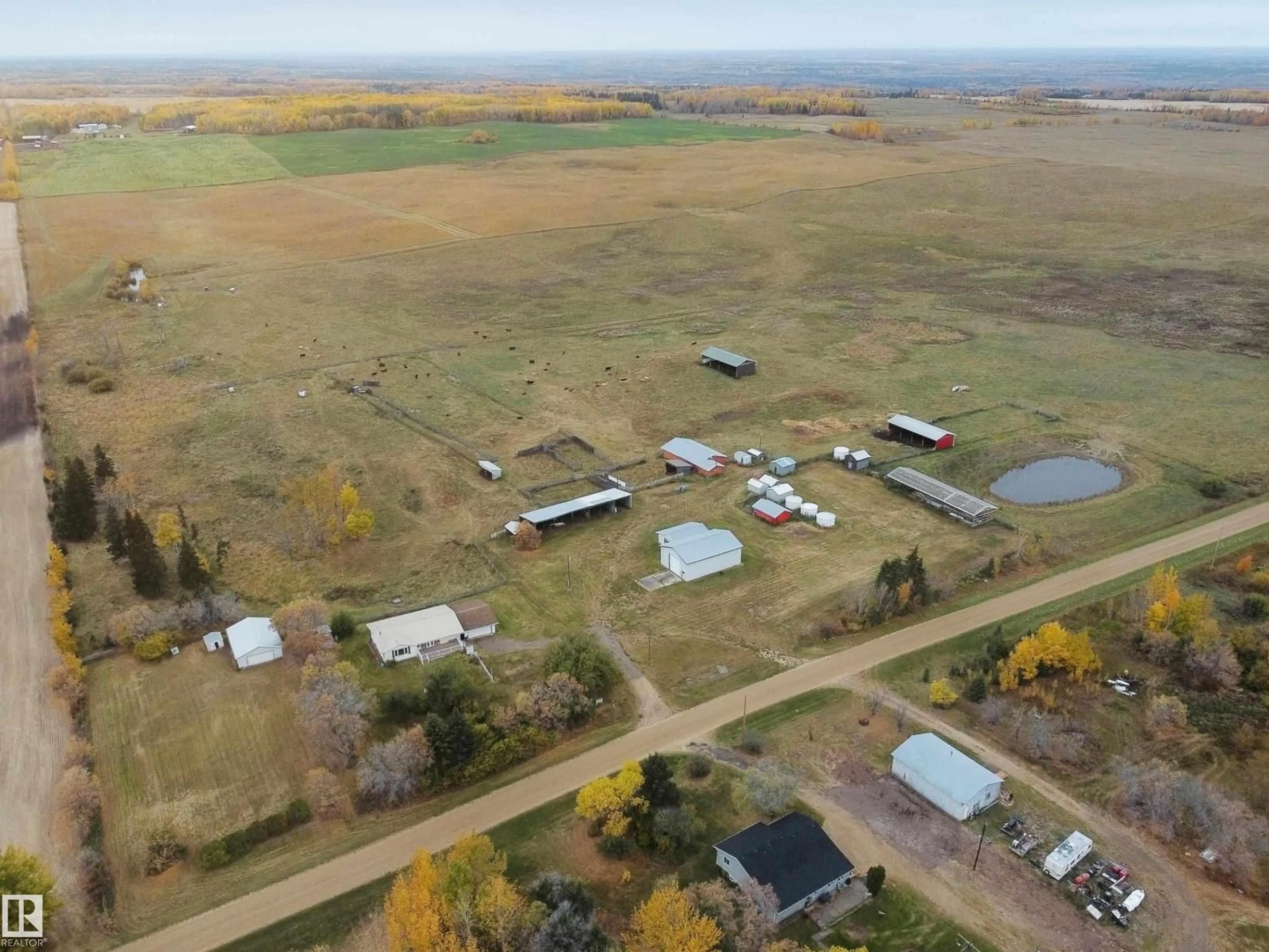 A pic from outside/outdoor area/front of a property/back of a property/a pic from drone, unknown for 61302 RGE RD 50, Rural Barrhead County Alberta T7N1N2