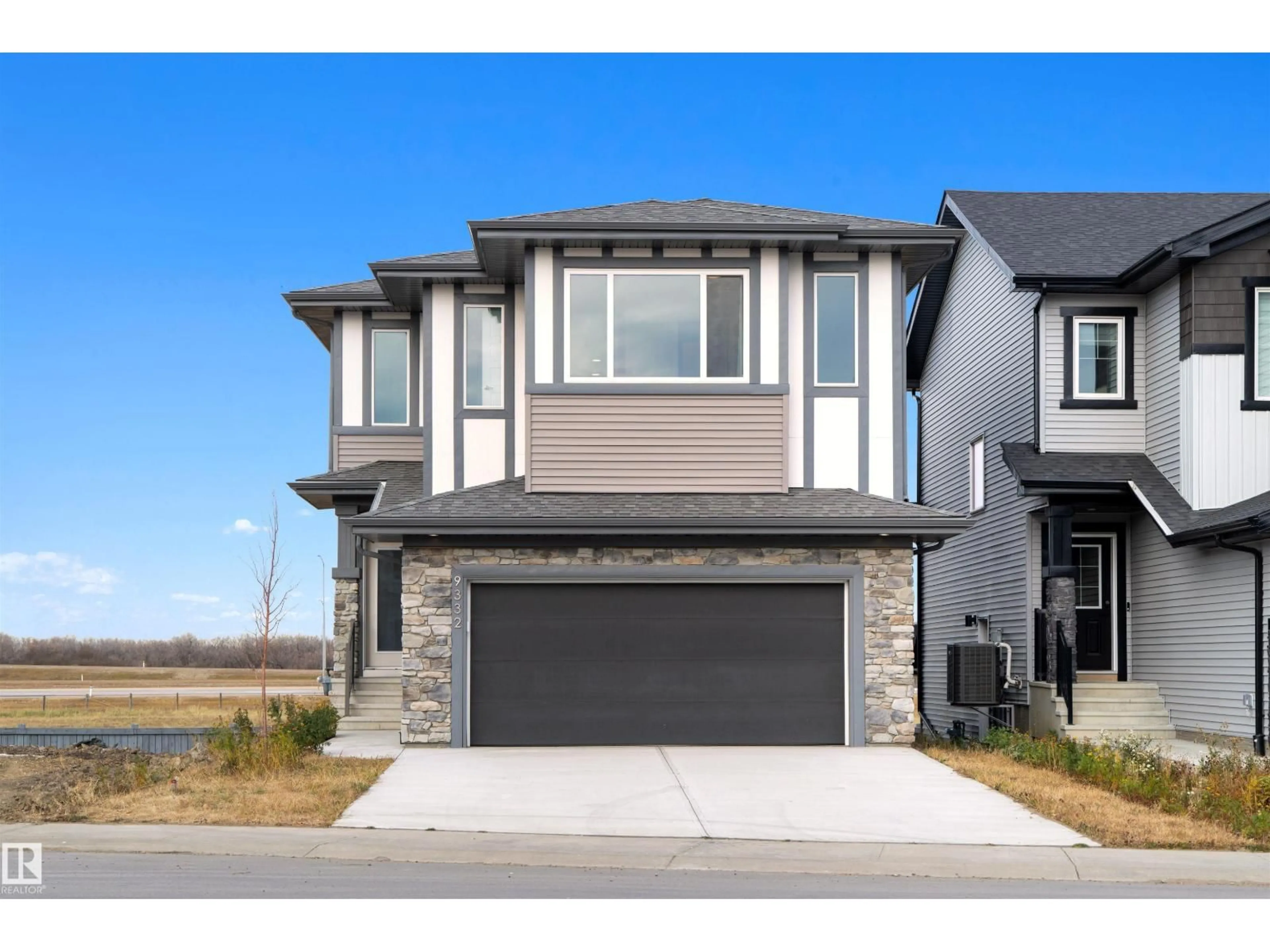 Home with vinyl exterior material, street for 9332 183 AV, Edmonton Alberta T5Z0V1