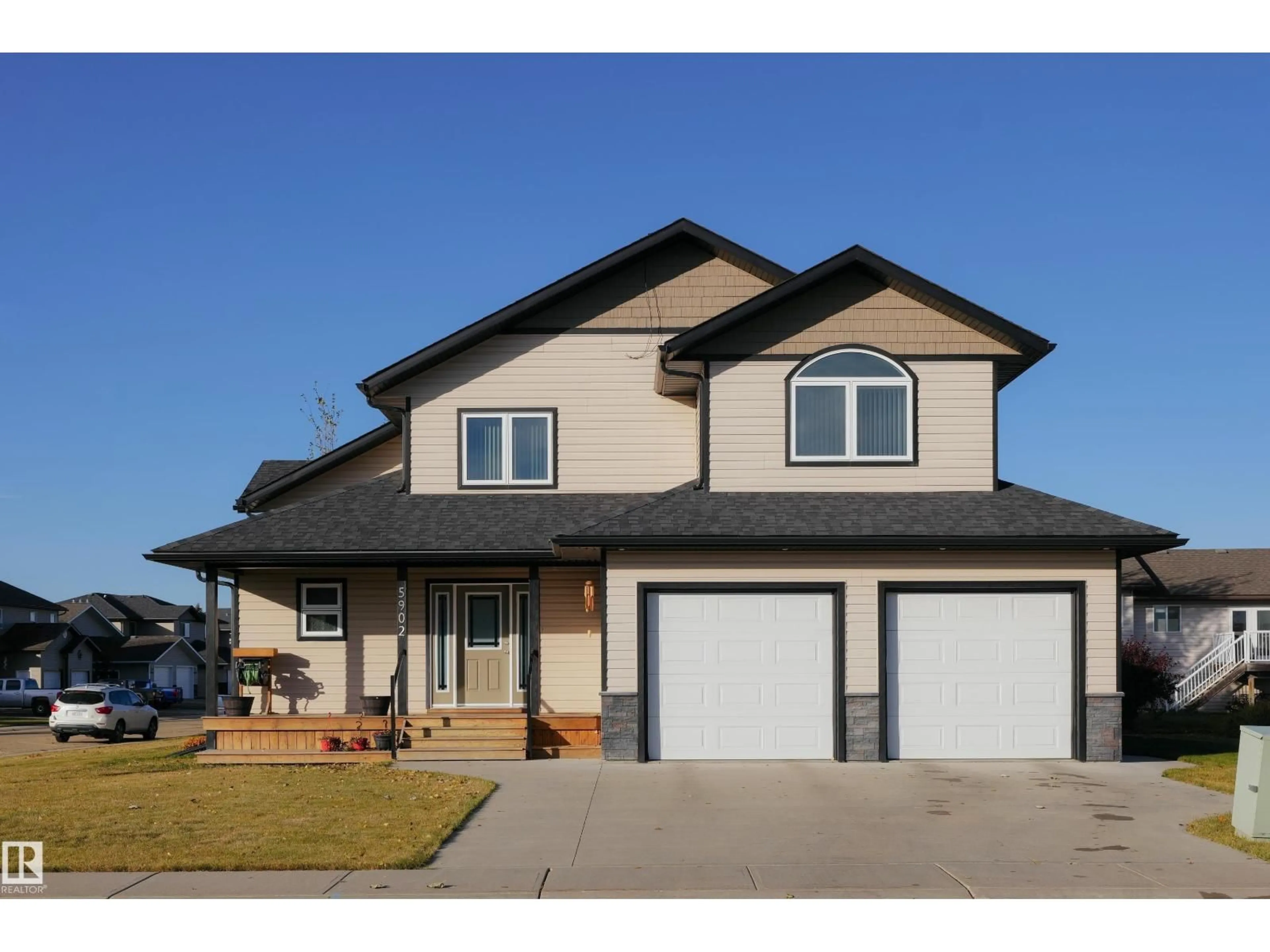 Home with vinyl exterior material, street for 5902 44 STREET, Barrhead Alberta T7N0A4