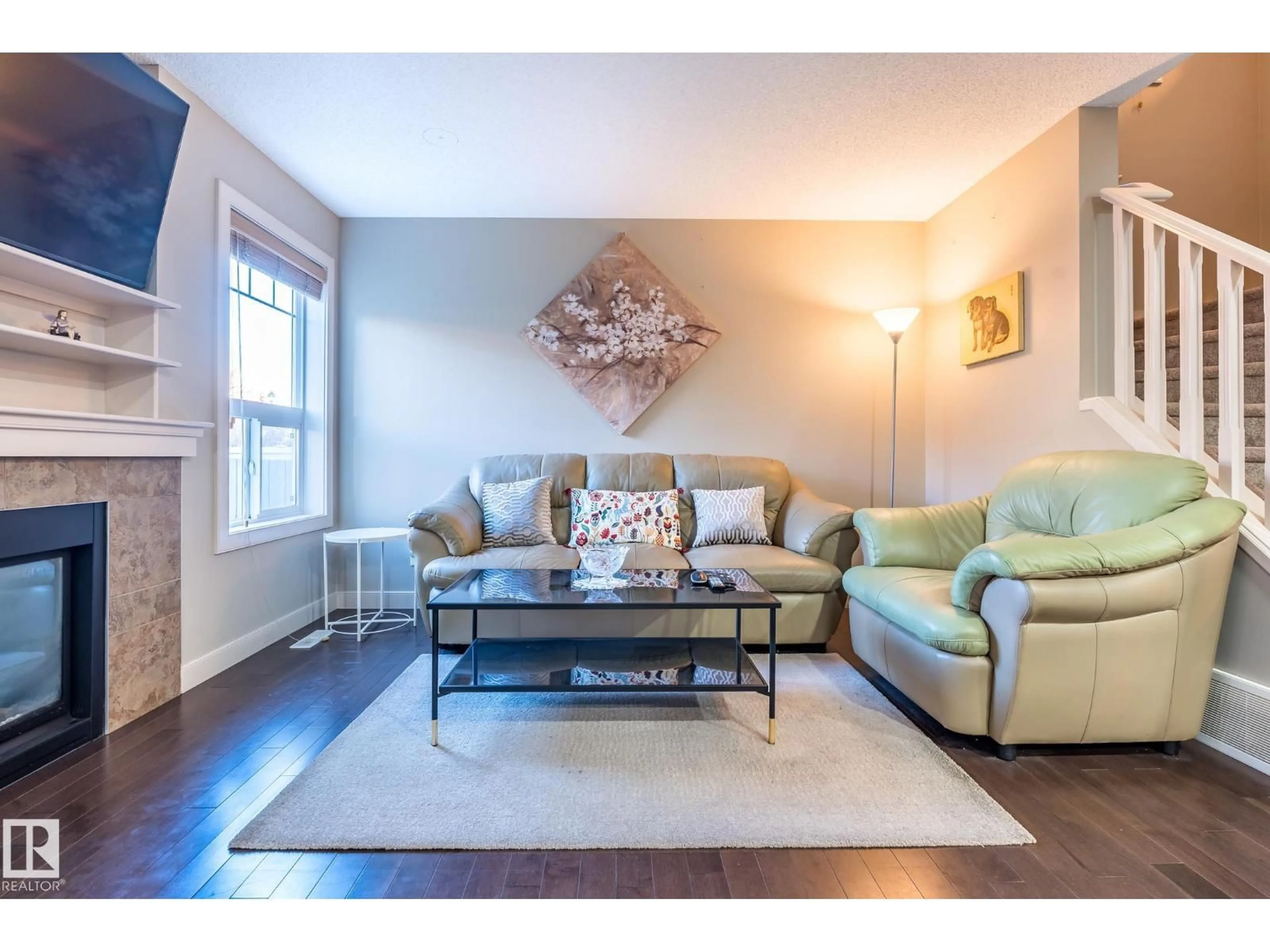 Living room with furniture, wood/laminate floor for 1692 CUNNINGHAM WY, Edmonton Alberta T6W0W5