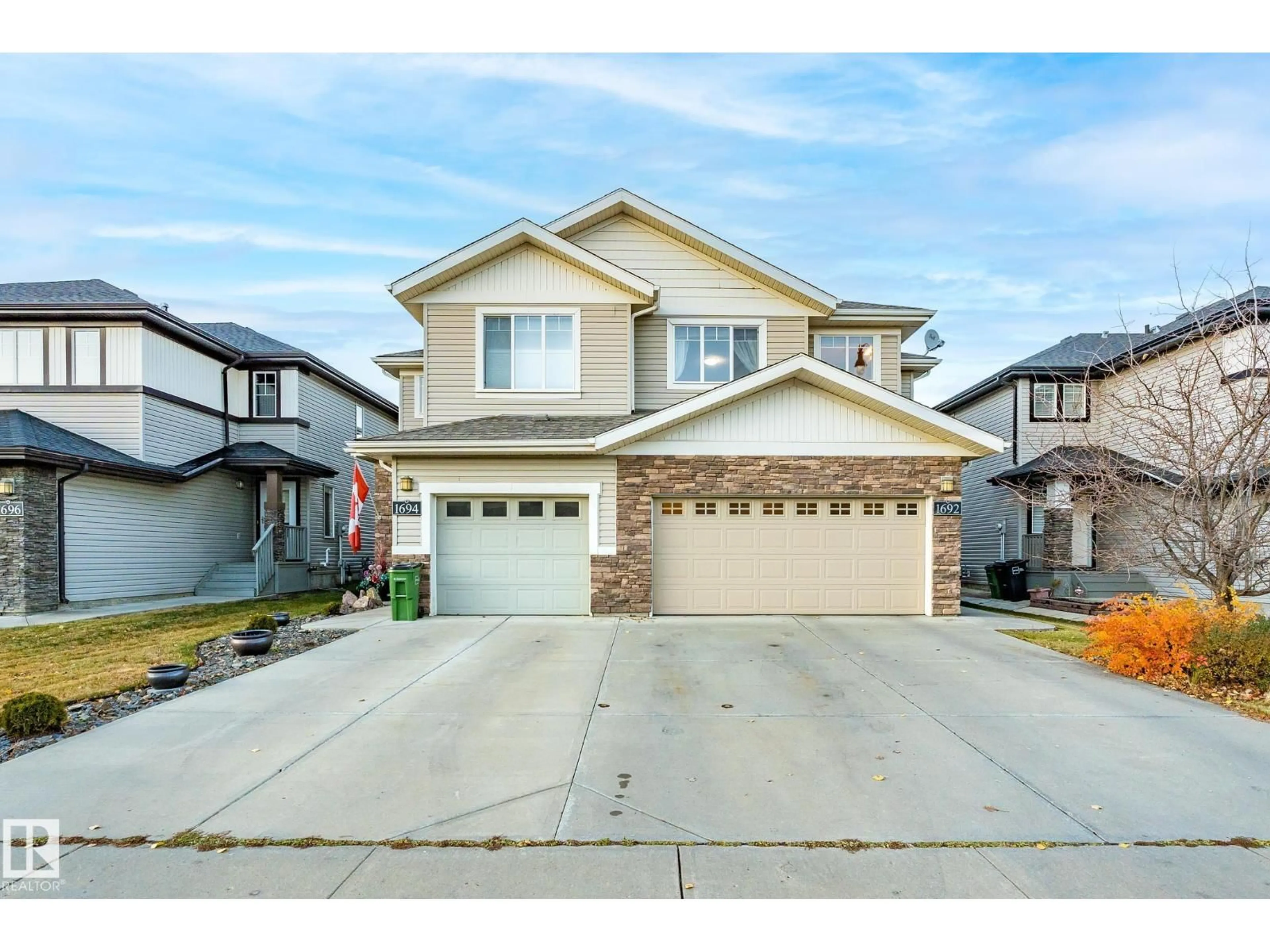Home with vinyl exterior material, street for 1692 CUNNINGHAM WY, Edmonton Alberta T6W0W5