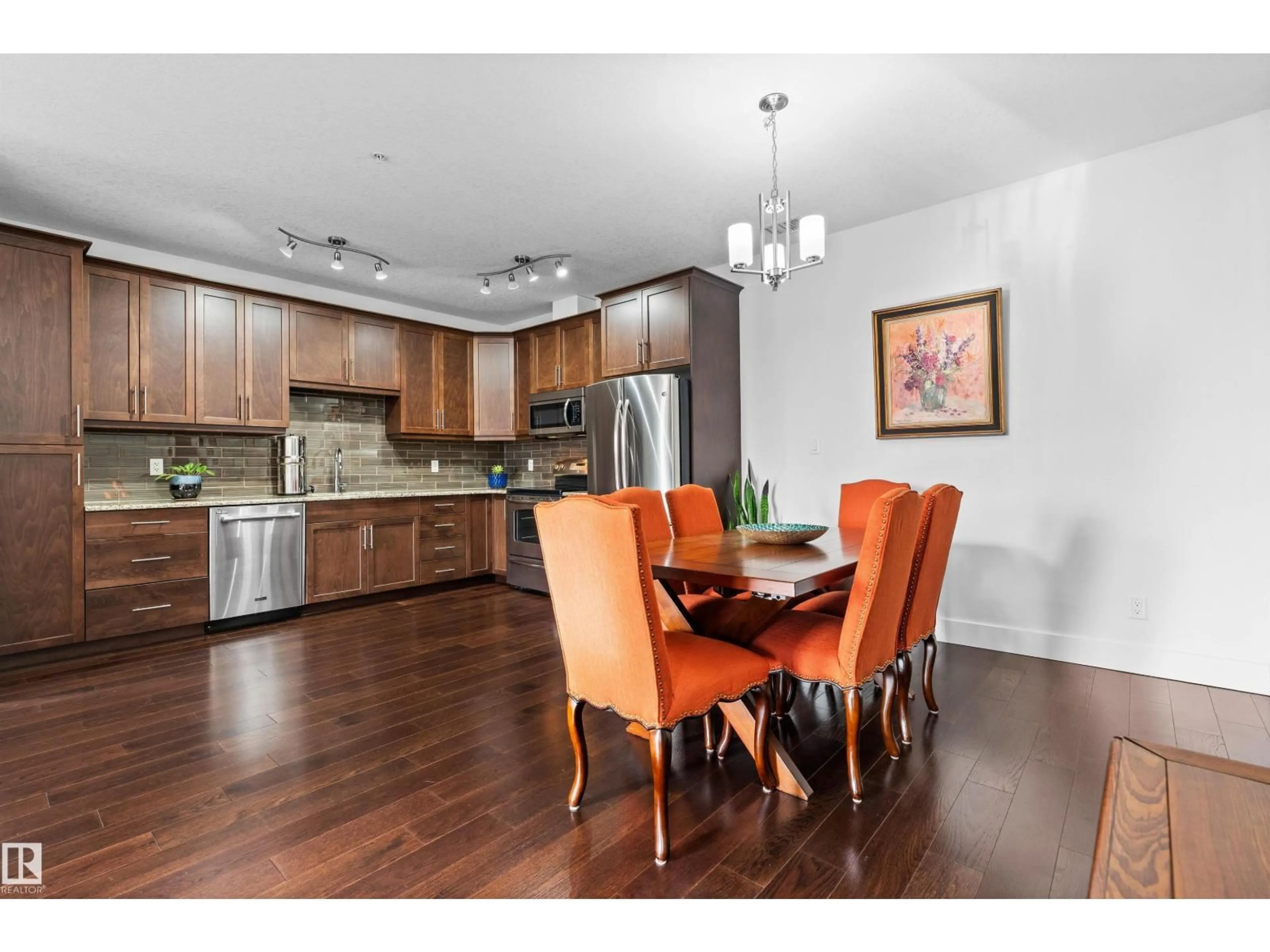 Open concept kitchen, wood/laminate floor for 356 - 6079 MAYNARD WY, Edmonton Alberta T6R0S4