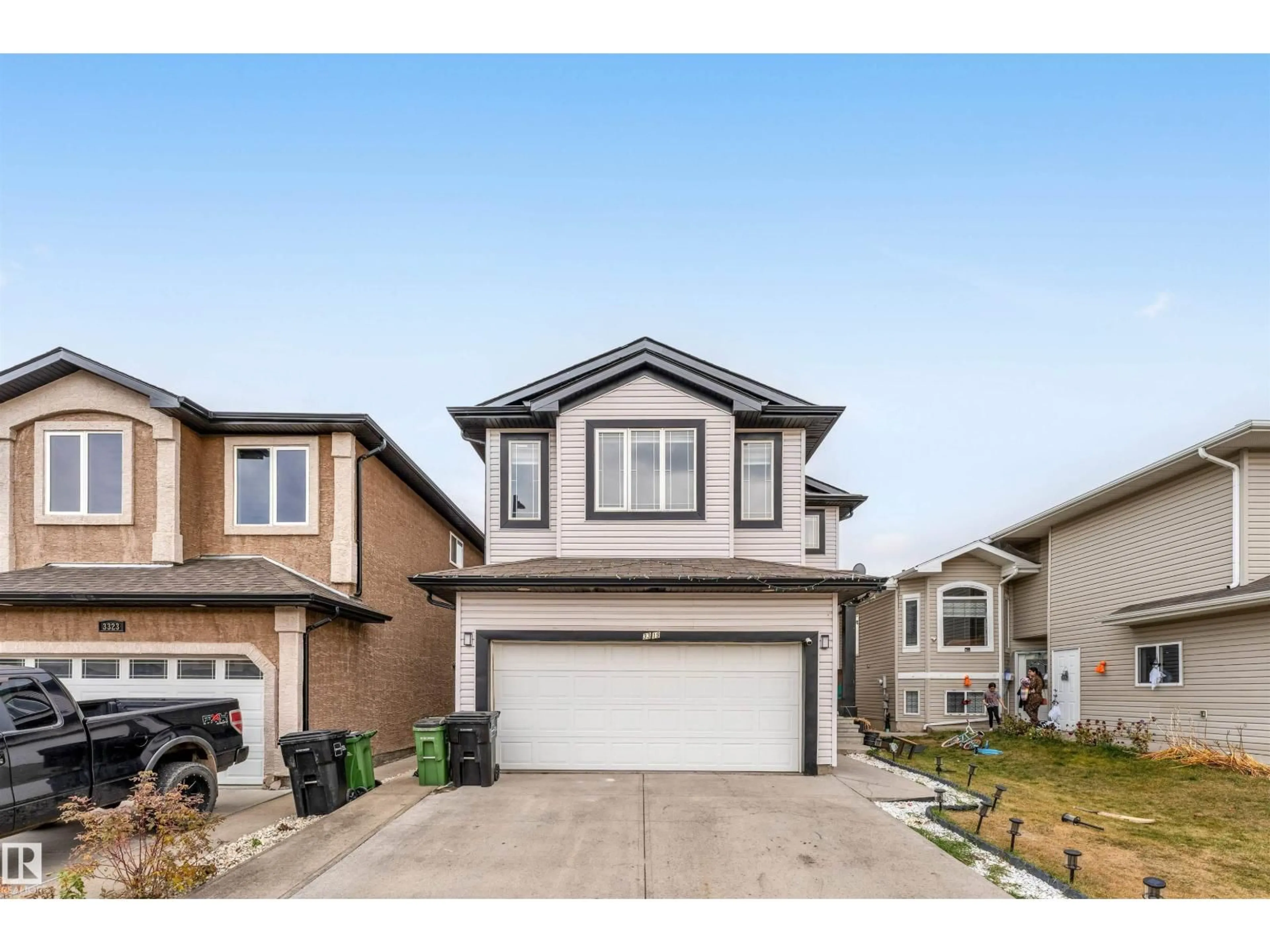 Home with vinyl exterior material, street for 3319 18 ST, Edmonton Alberta T6T0H4