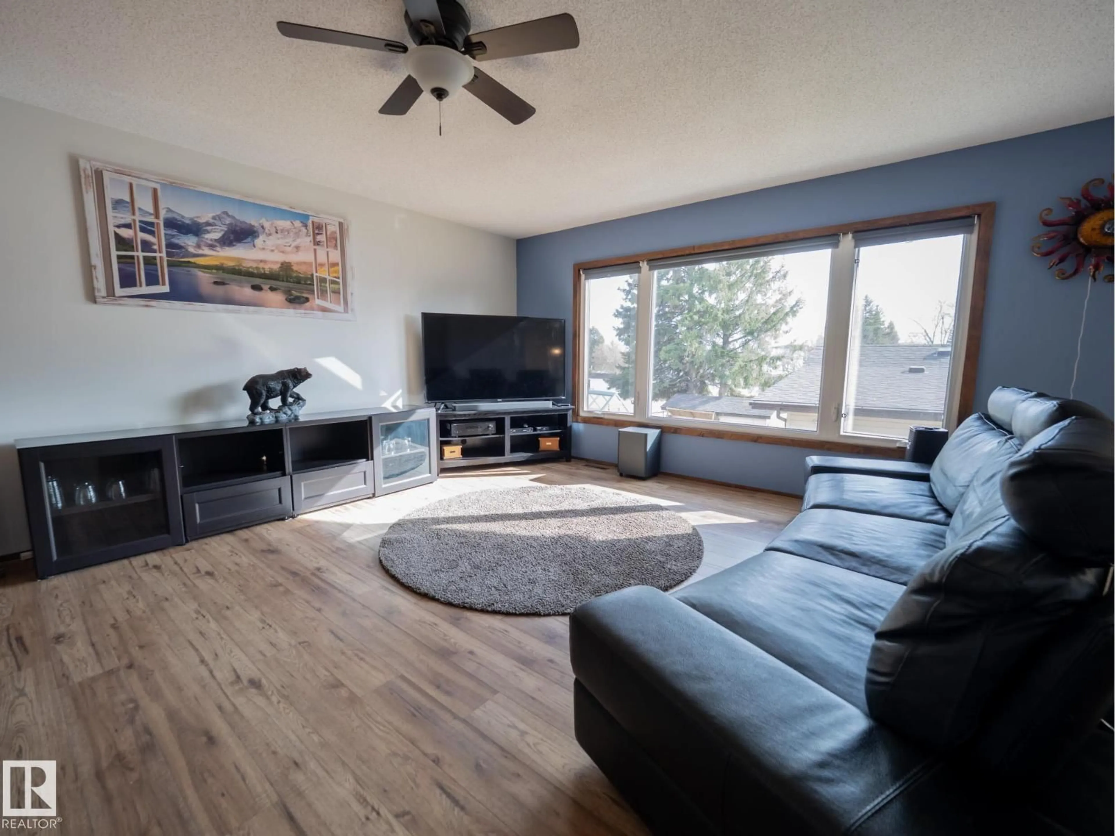 Living room with furniture, wood/laminate floor for 403 4 ST, Rural Lac Ste. Anne County Alberta T0E1A0