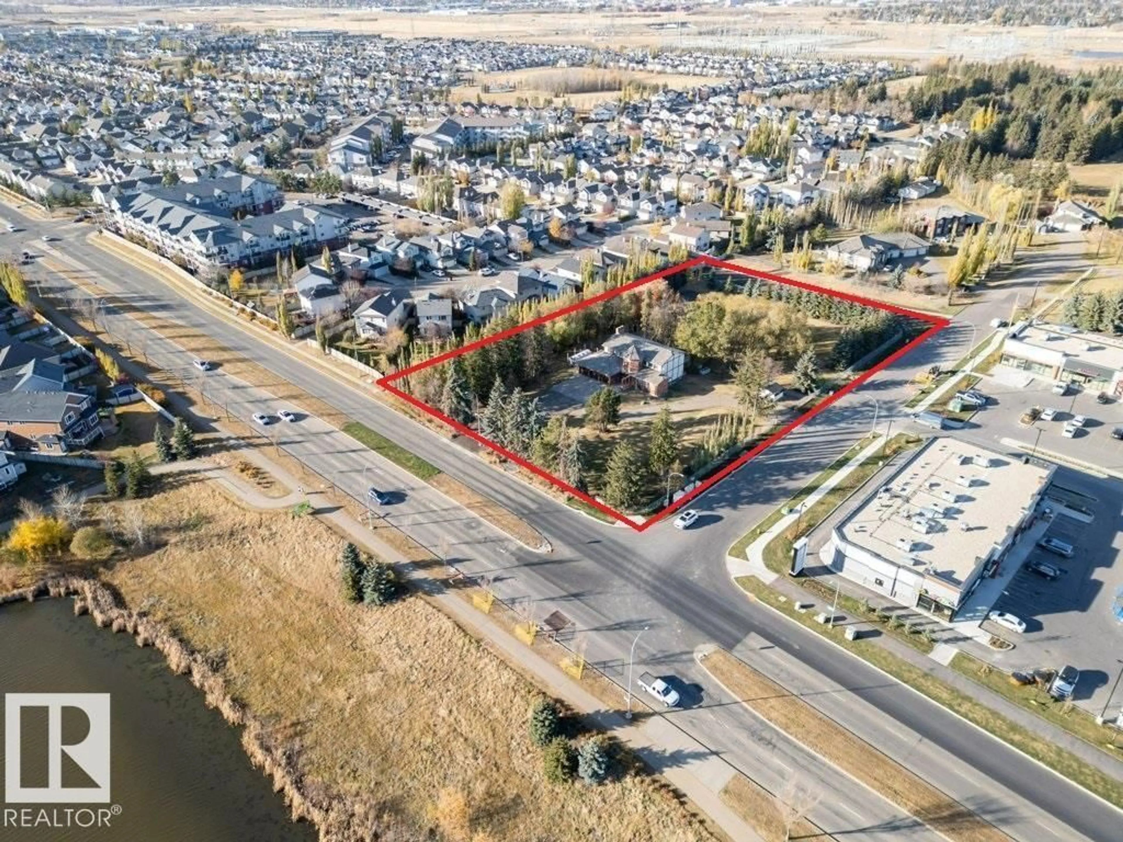 A pic from outside/outdoor area/front of a property/back of a property/a pic from drone, street for 7550 ELLERSLIE RD, Edmonton Alberta T6X1A3