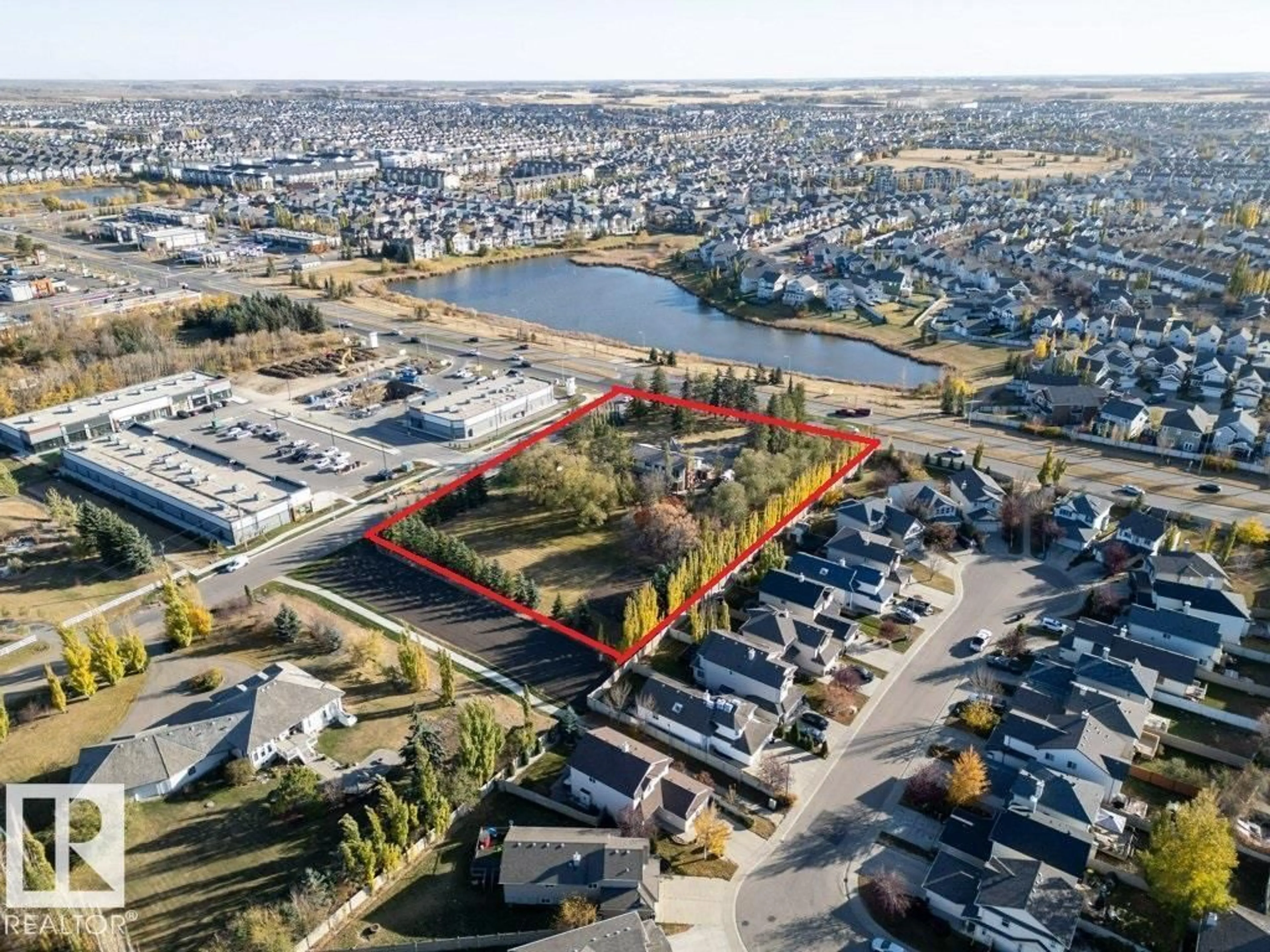 A pic from outside/outdoor area/front of a property/back of a property/a pic from drone, water/lake/river/ocean view for 7550 ELLERSLIE RD, Edmonton Alberta T6X1A3