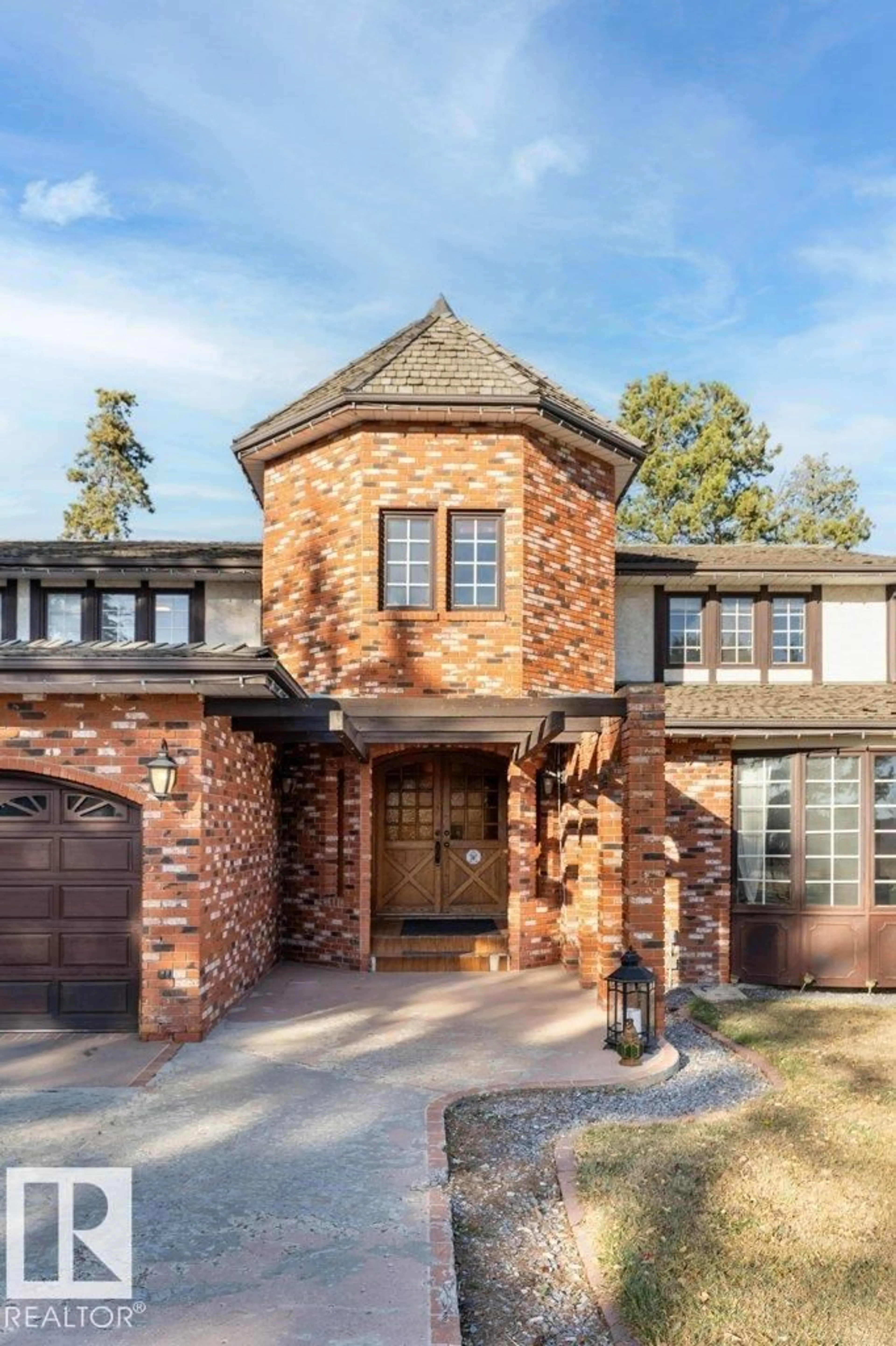 Home with brick exterior material, street for 7550 ELLERSLIE RD, Edmonton Alberta T6X1A3