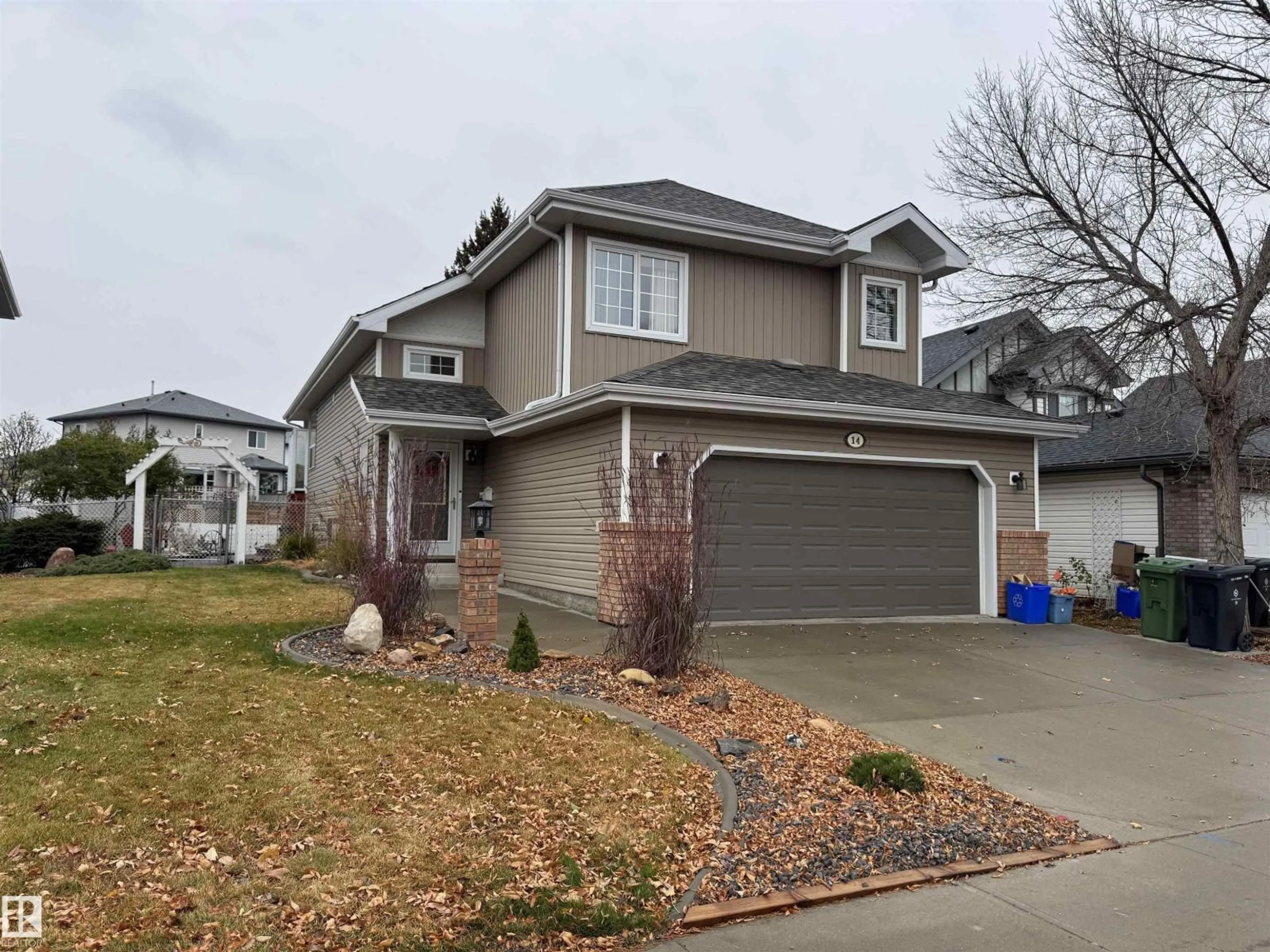 Home with vinyl exterior material, street for 14 WESTWOOD WY, Fort Saskatchewan Alberta T8L4G4