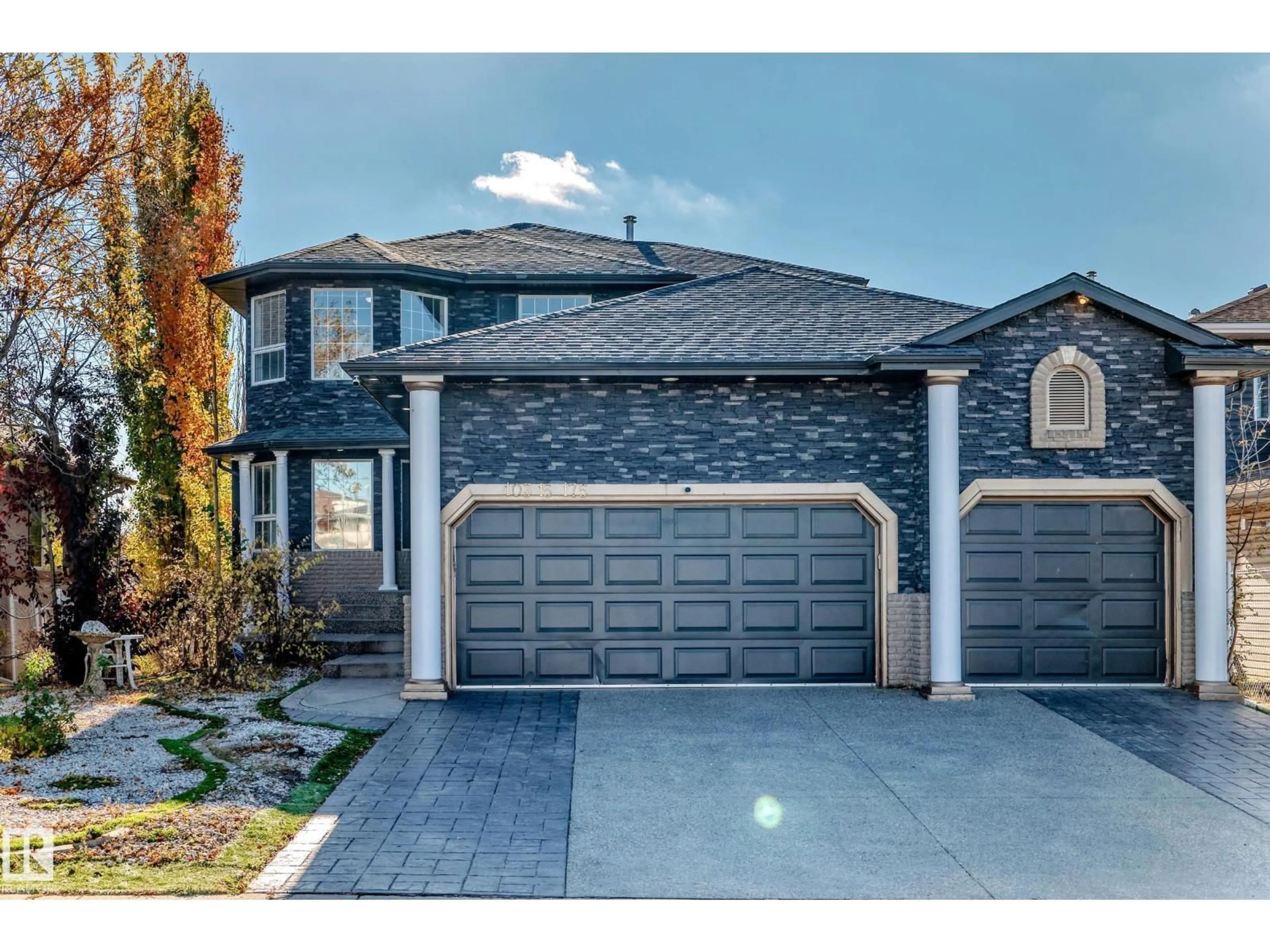 Home with brick exterior material, street for NW - 10315 175 AV, Edmonton Alberta T5X5W9