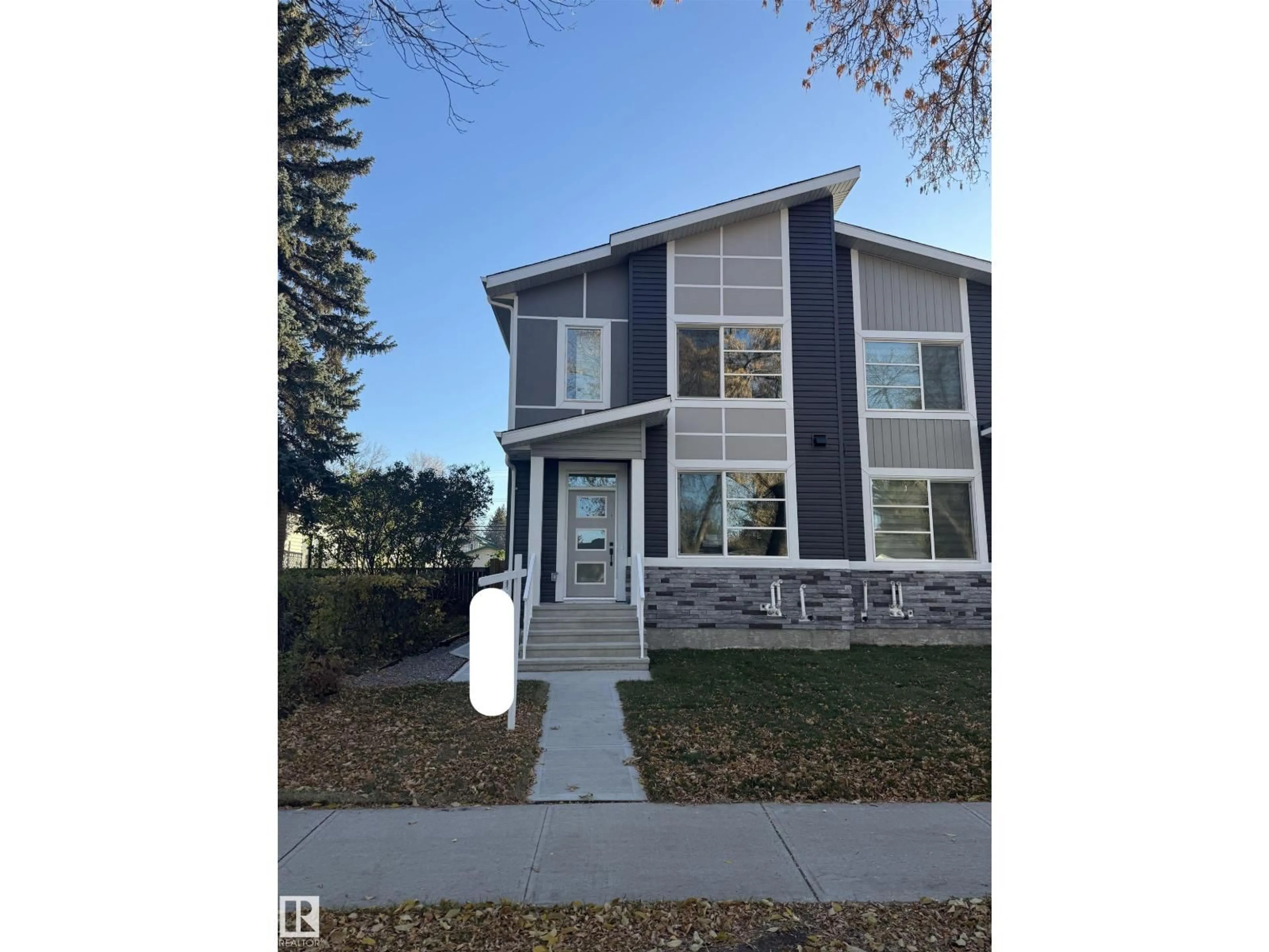 Home with vinyl exterior material, street for NW - 11927 123 ST, Edmonton Alberta T5L0G9