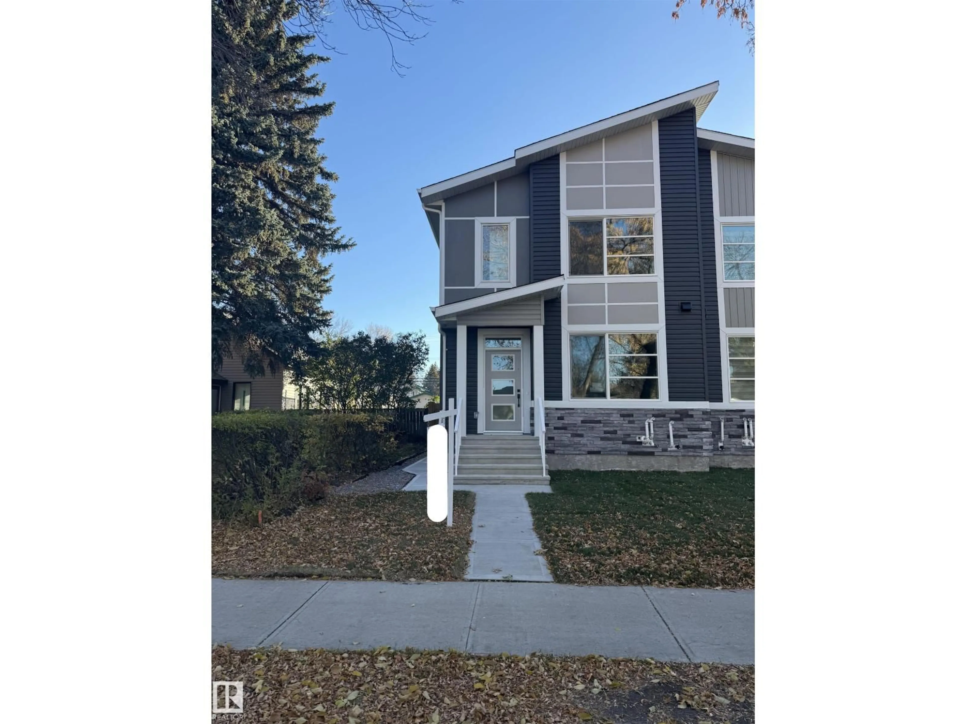 Home with vinyl exterior material, street for NW - 11927 123 ST, Edmonton Alberta T5L0G9