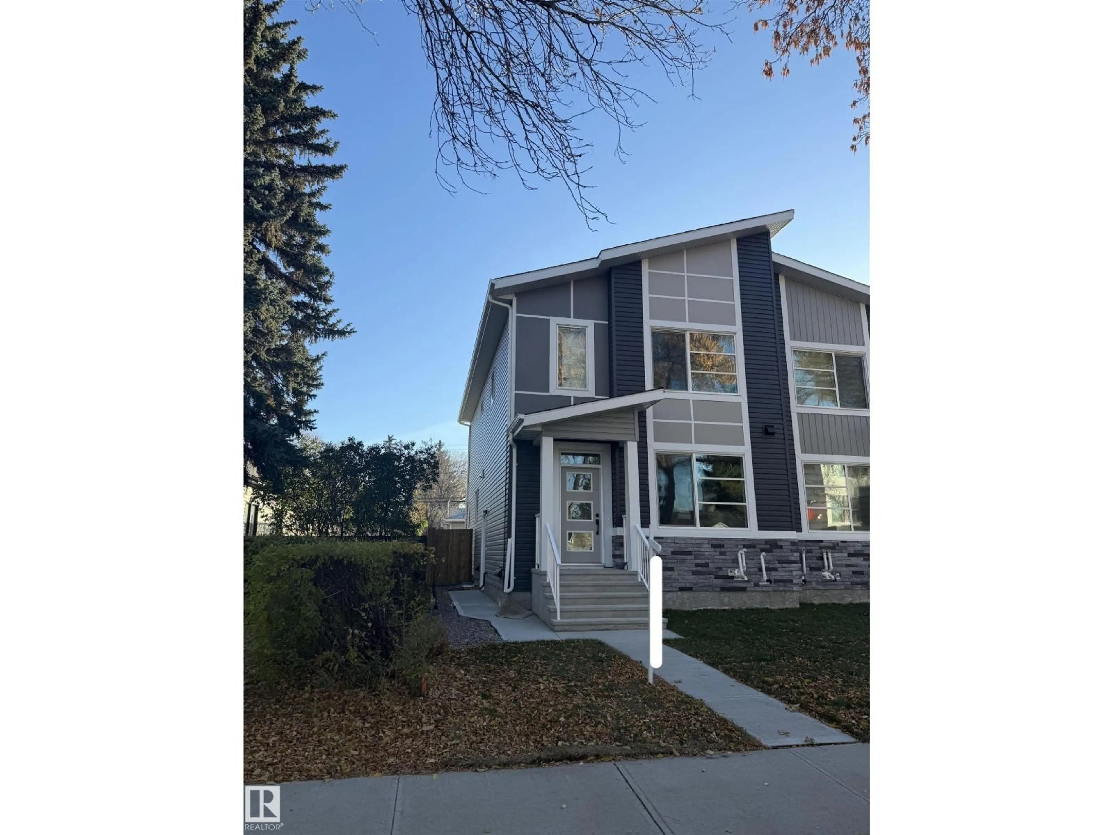 Home with vinyl exterior material, street for NW - 11927 123 ST, Edmonton Alberta T5L0G9